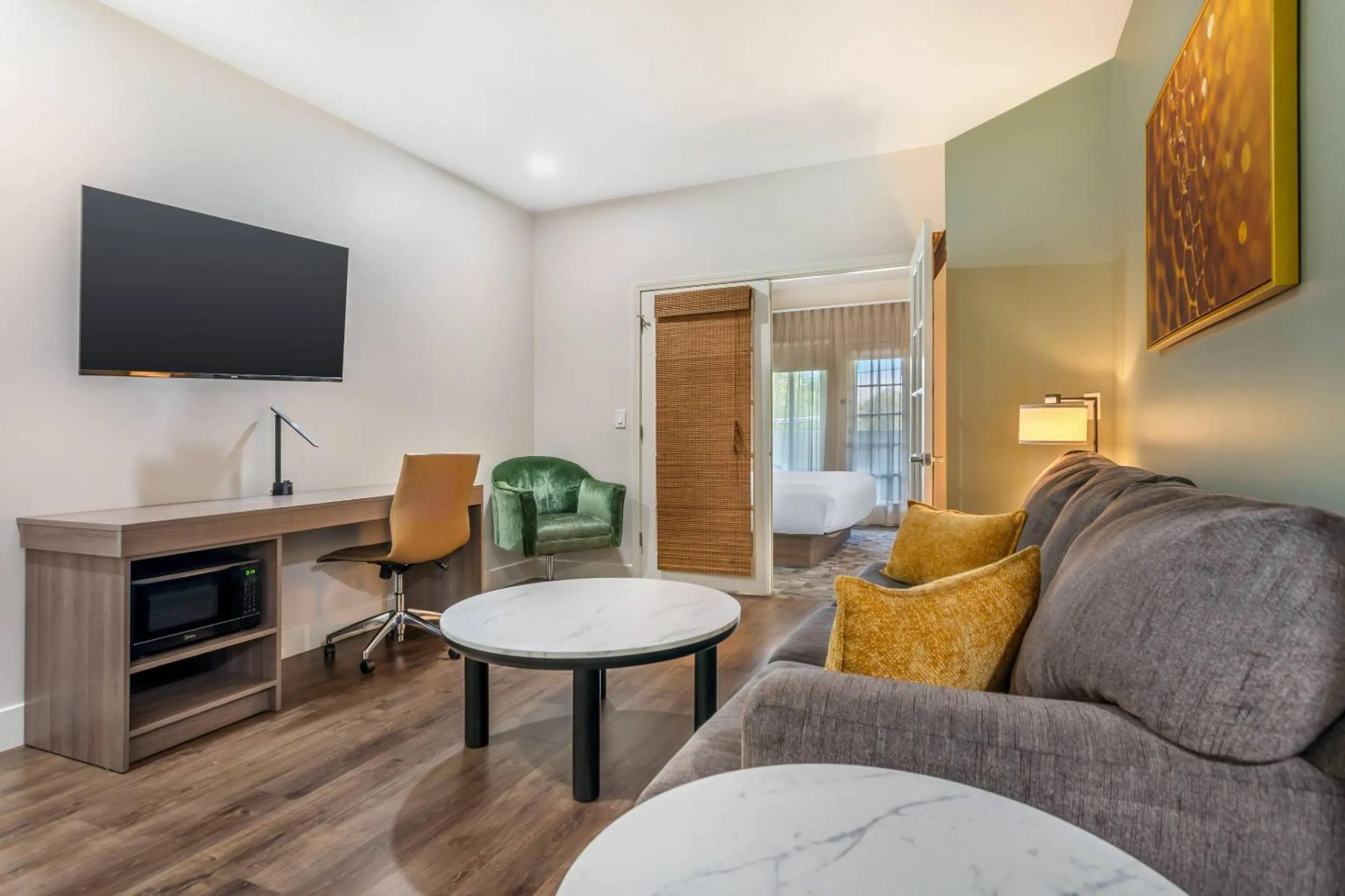 Bedroom in University Park Inn & Suites, an Ascend Collection Hotel