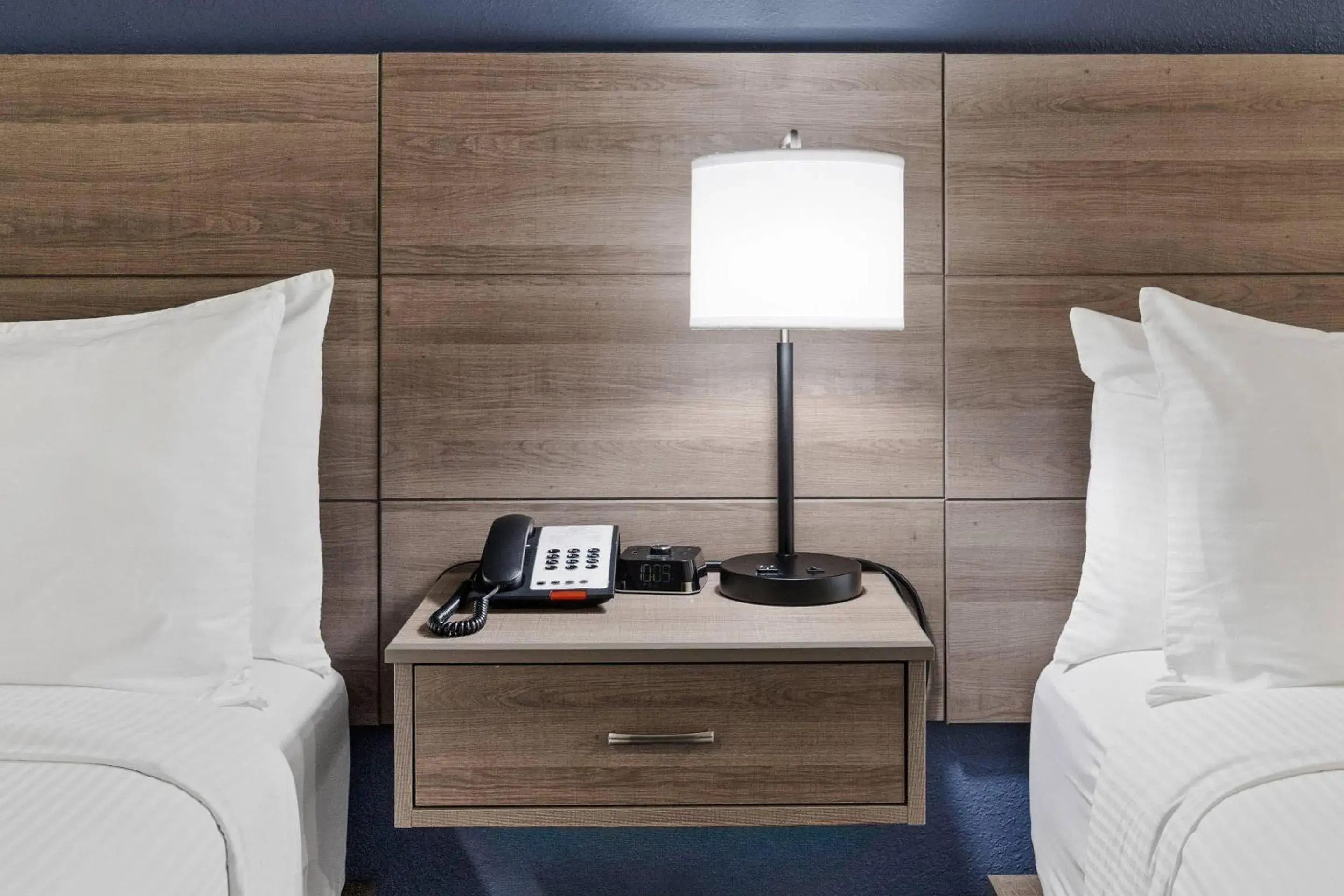 Bedroom in University Park Inn & Suites, an Ascend Collection Hotel Bedroom in University Park Inn & Suites, an Ascend Collection Hotel