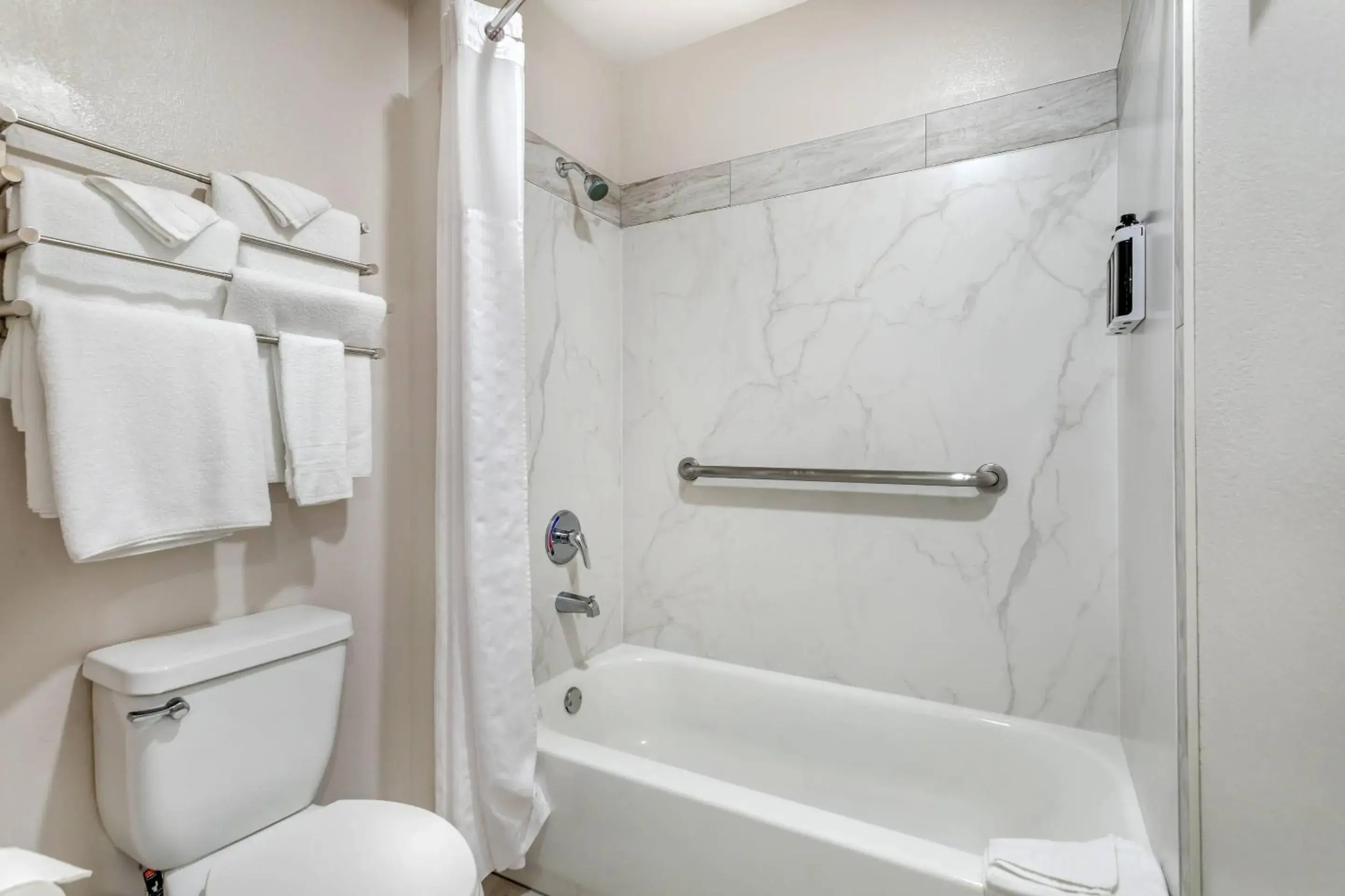 Bedroom in University Park Inn & Suites, an Ascend Collection Hotel Bedroom in University Park Inn & Suites, an Ascend Collection Hotel