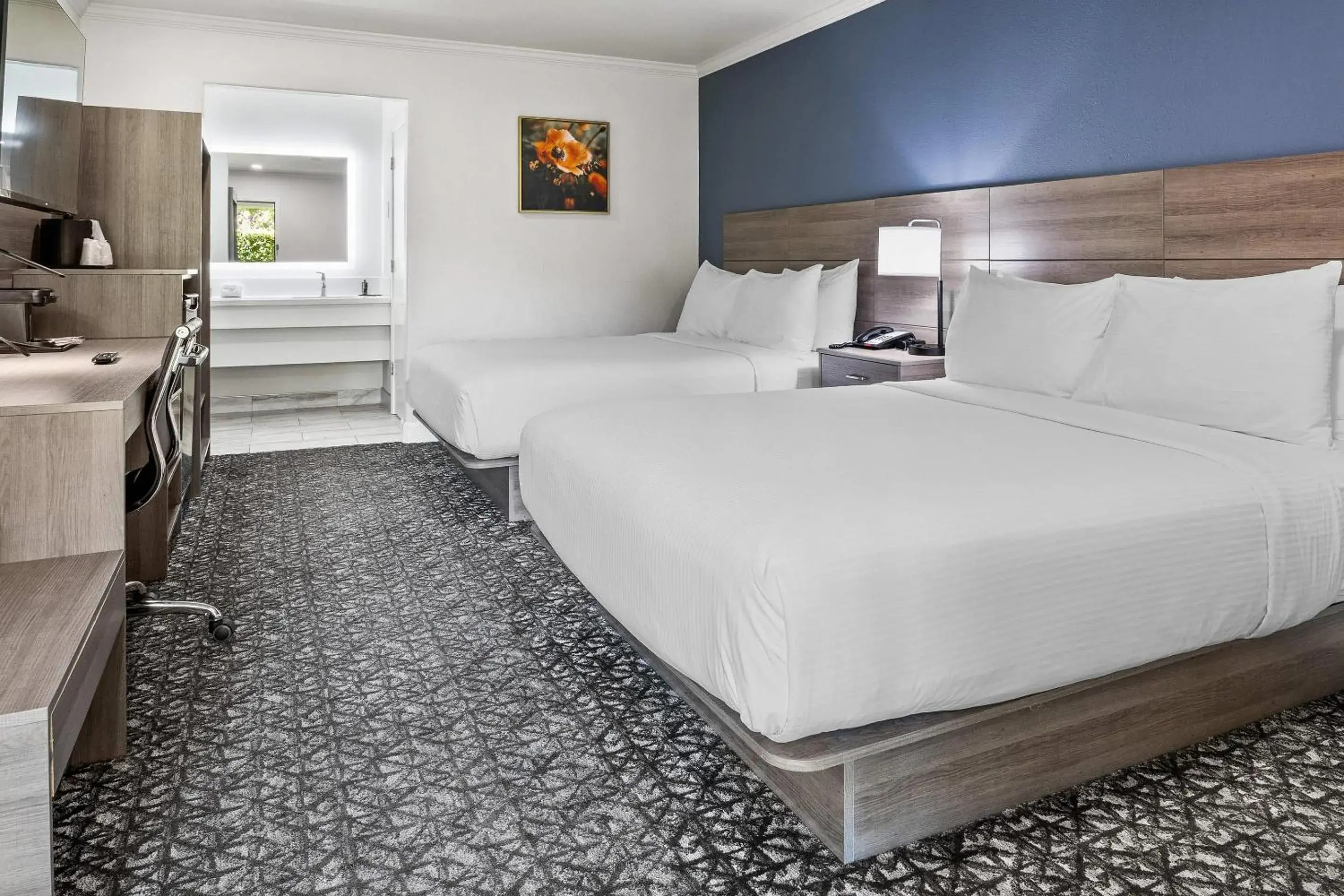 Bedroom, Bed in University Park Inn & Suites, an Ascend Collection Hotel Bedroom, Bed in University Park Inn & Suites, an Ascend Collection Hotel