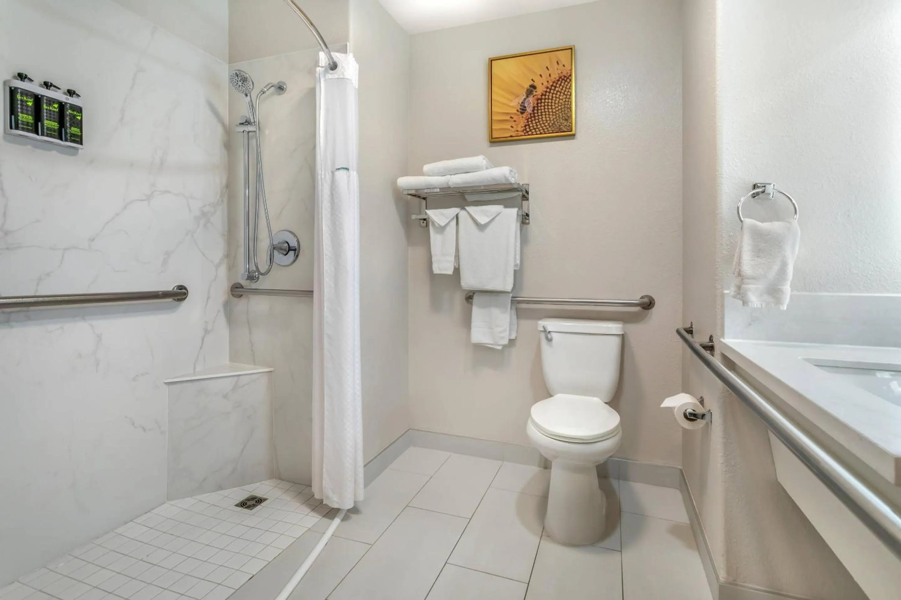 Bedroom in University Park Inn & Suites, an Ascend Collection Hotel