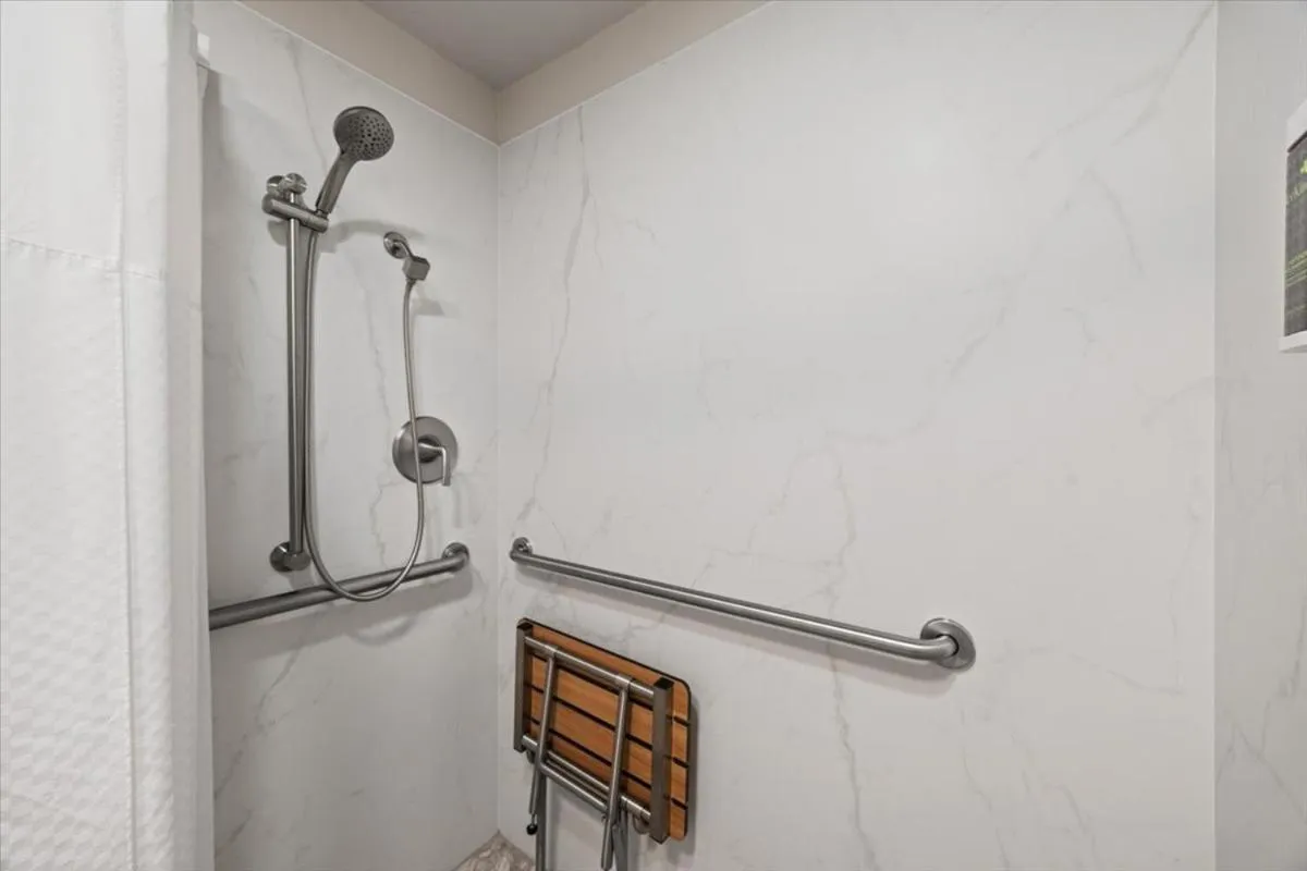 Bathroom in University Park Inn & Suites, an Ascend Collection Hotel