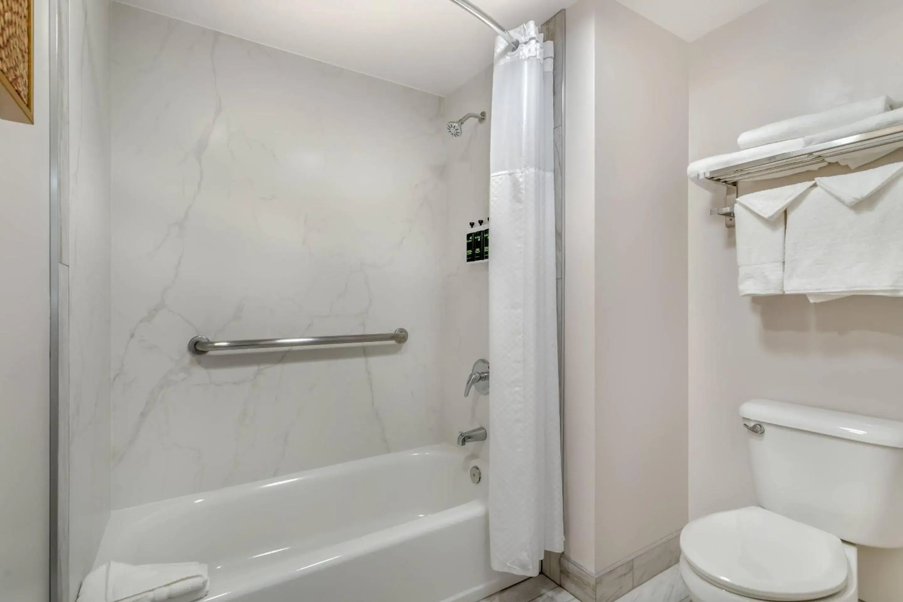 Bedroom in University Park Inn & Suites, an Ascend Collection Hotel Bedroom in University Park Inn & Suites, an Ascend Collection Hotel