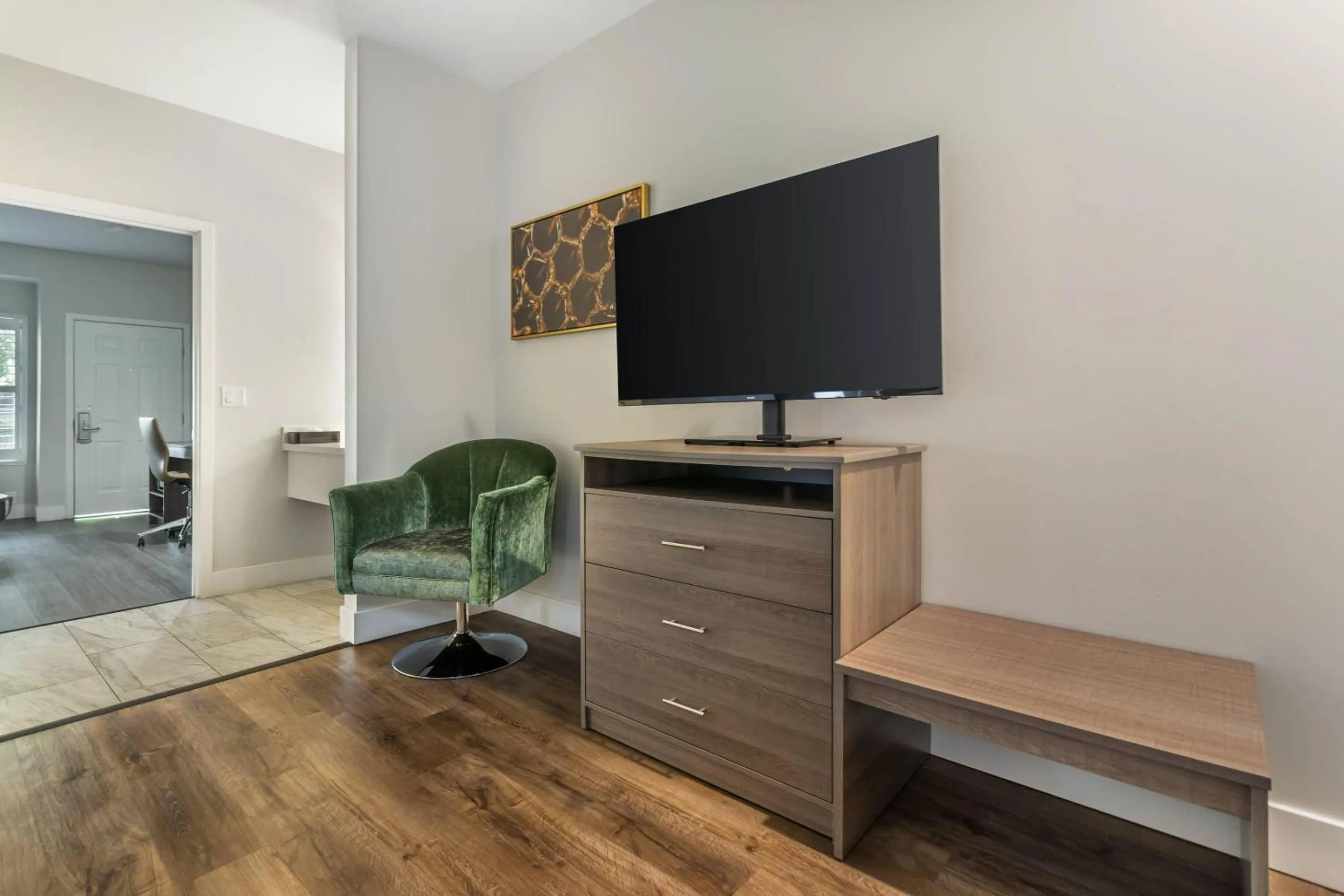 Bedroom in University Park Inn & Suites, an Ascend Collection Hotel