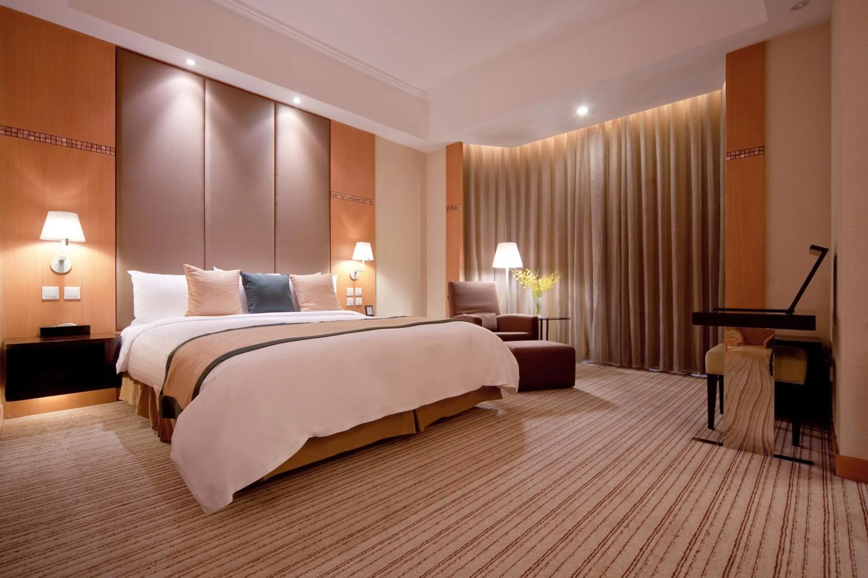 Bed in New World Shunde Hotel