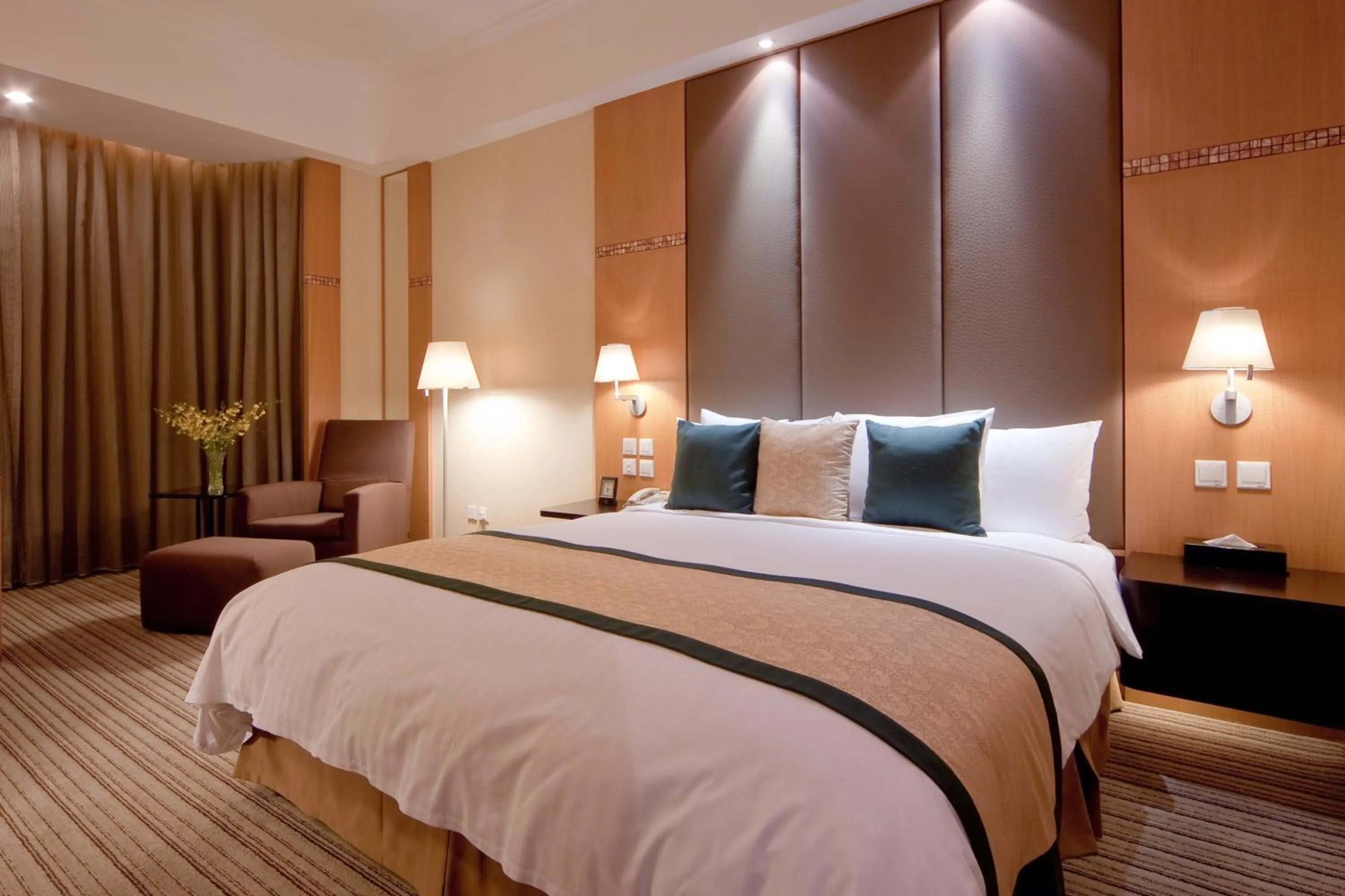 Bed in New World Shunde Hotel