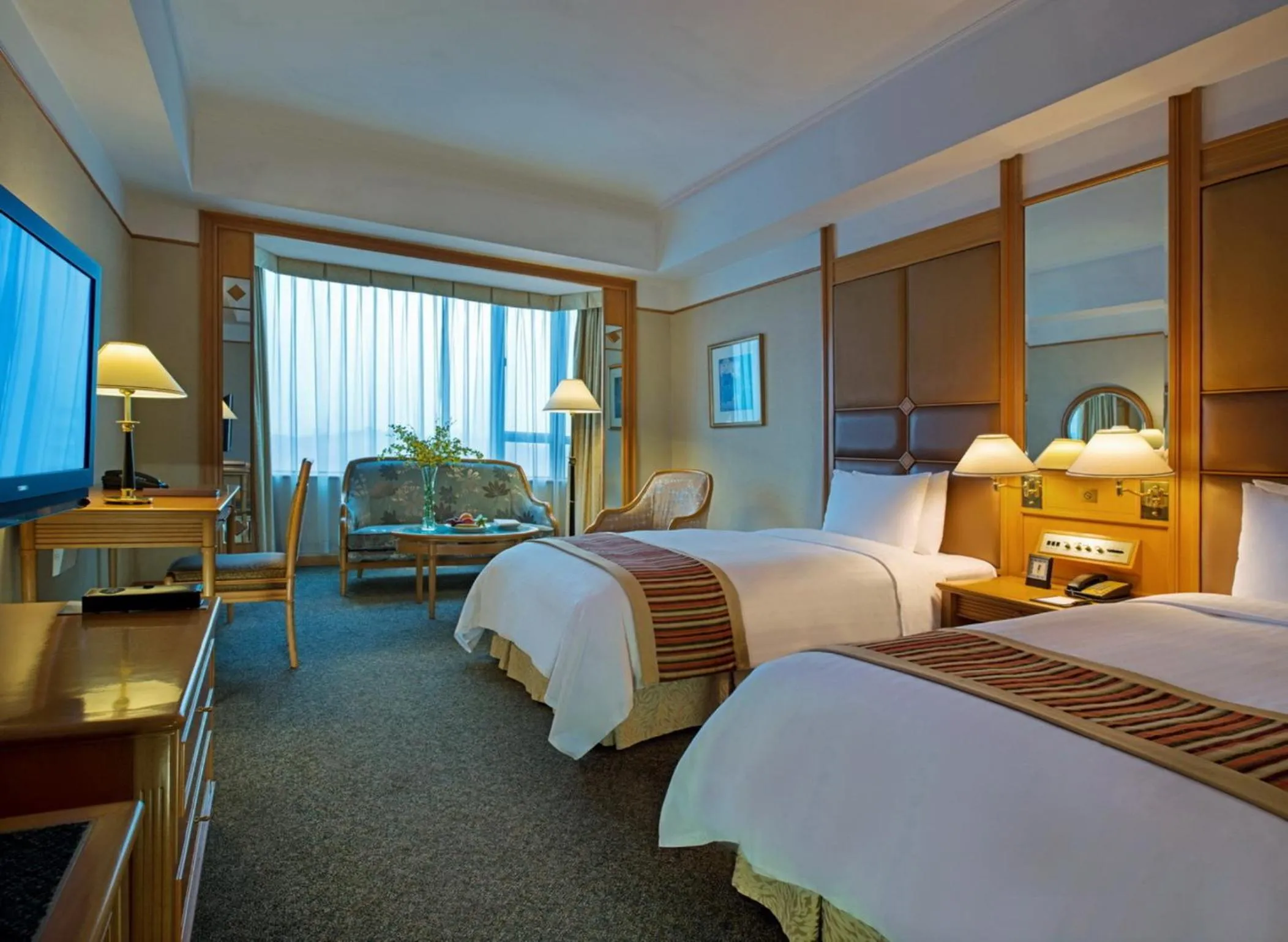 Bedroom in New World Shunde Hotel