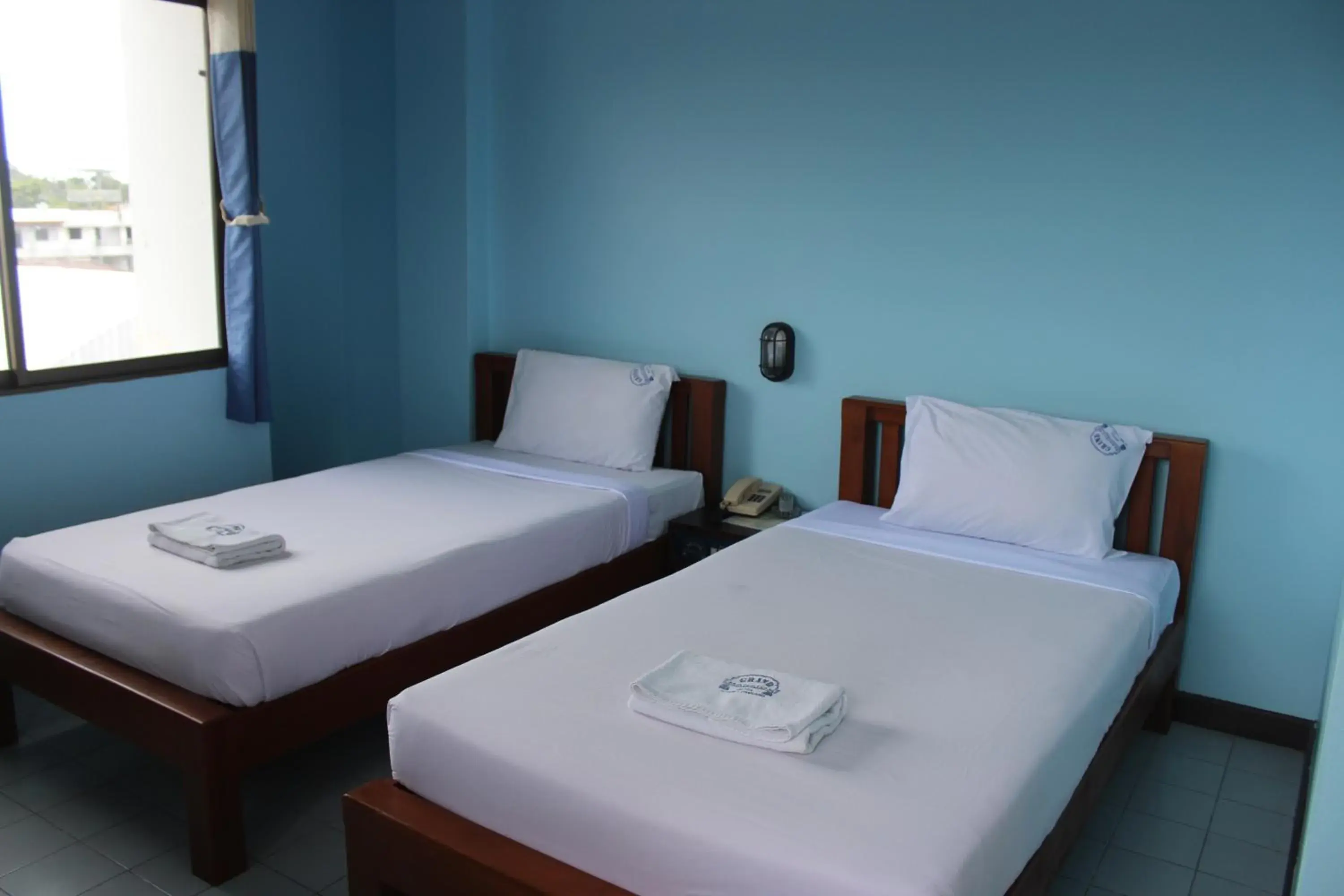 Bed in Grand Mansion Hotel Bed in Grand Mansion Hotel