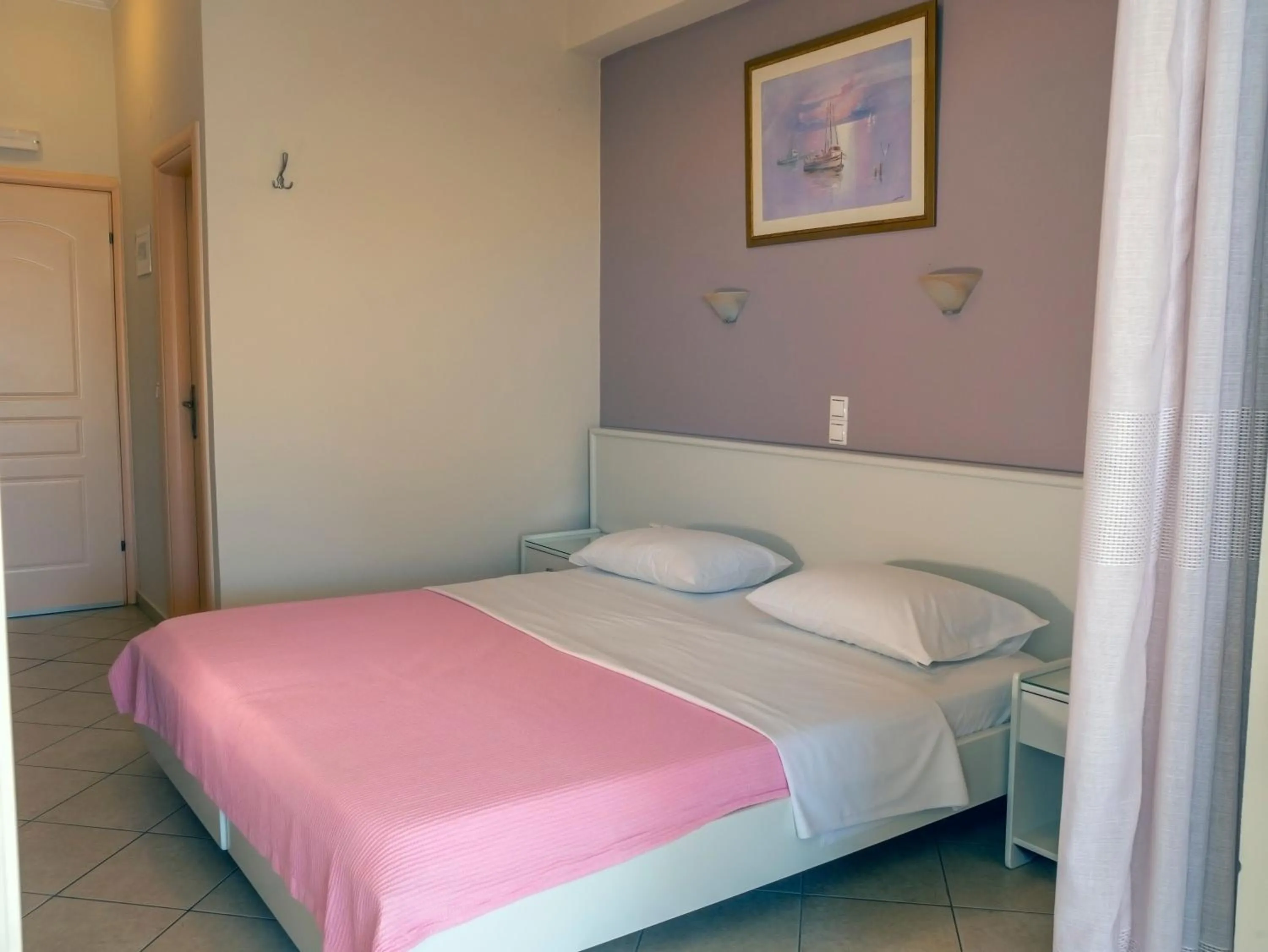 Bed in Hotel Loukas Vrachos