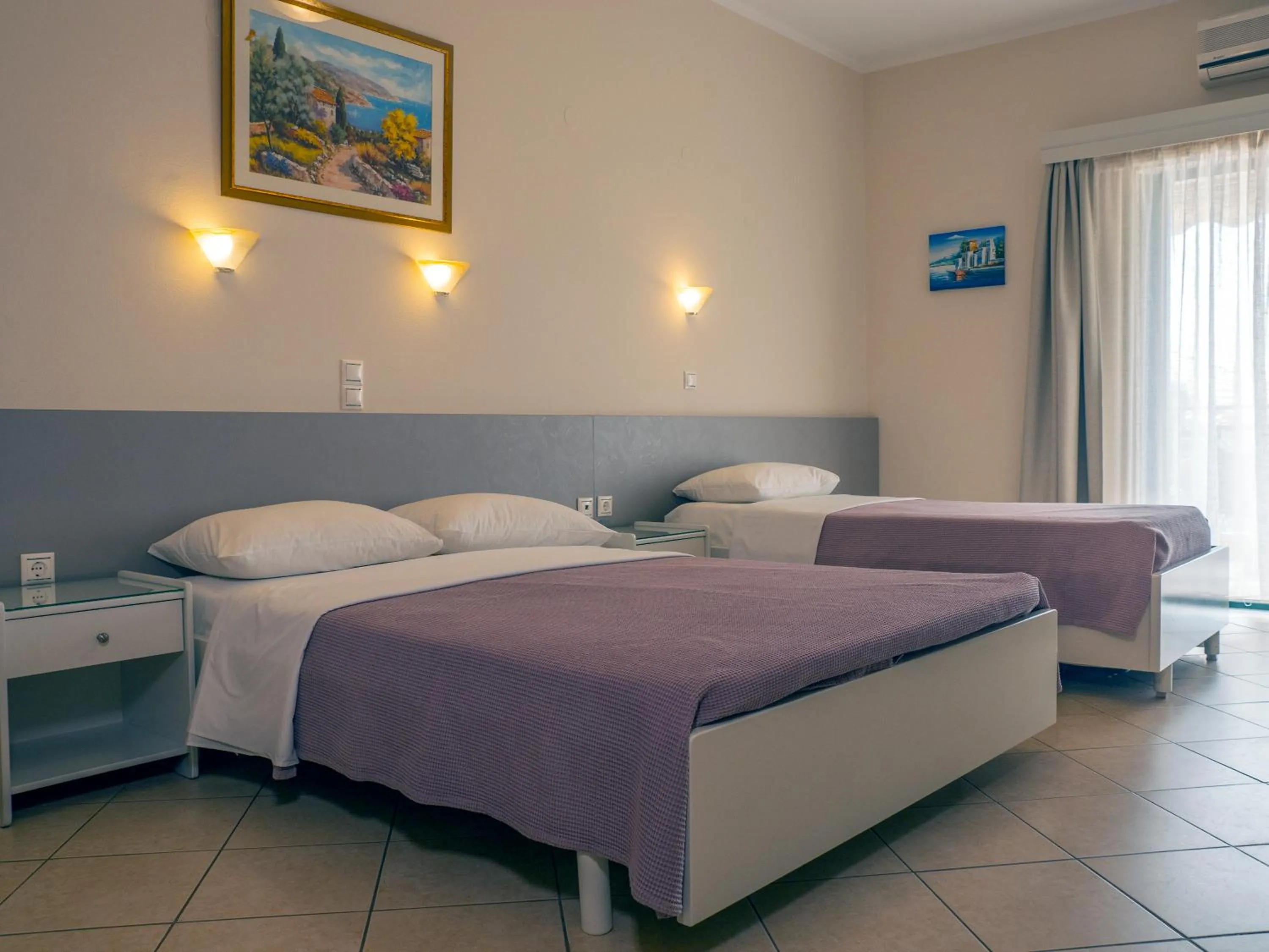 Bed in Hotel Loukas Vrachos