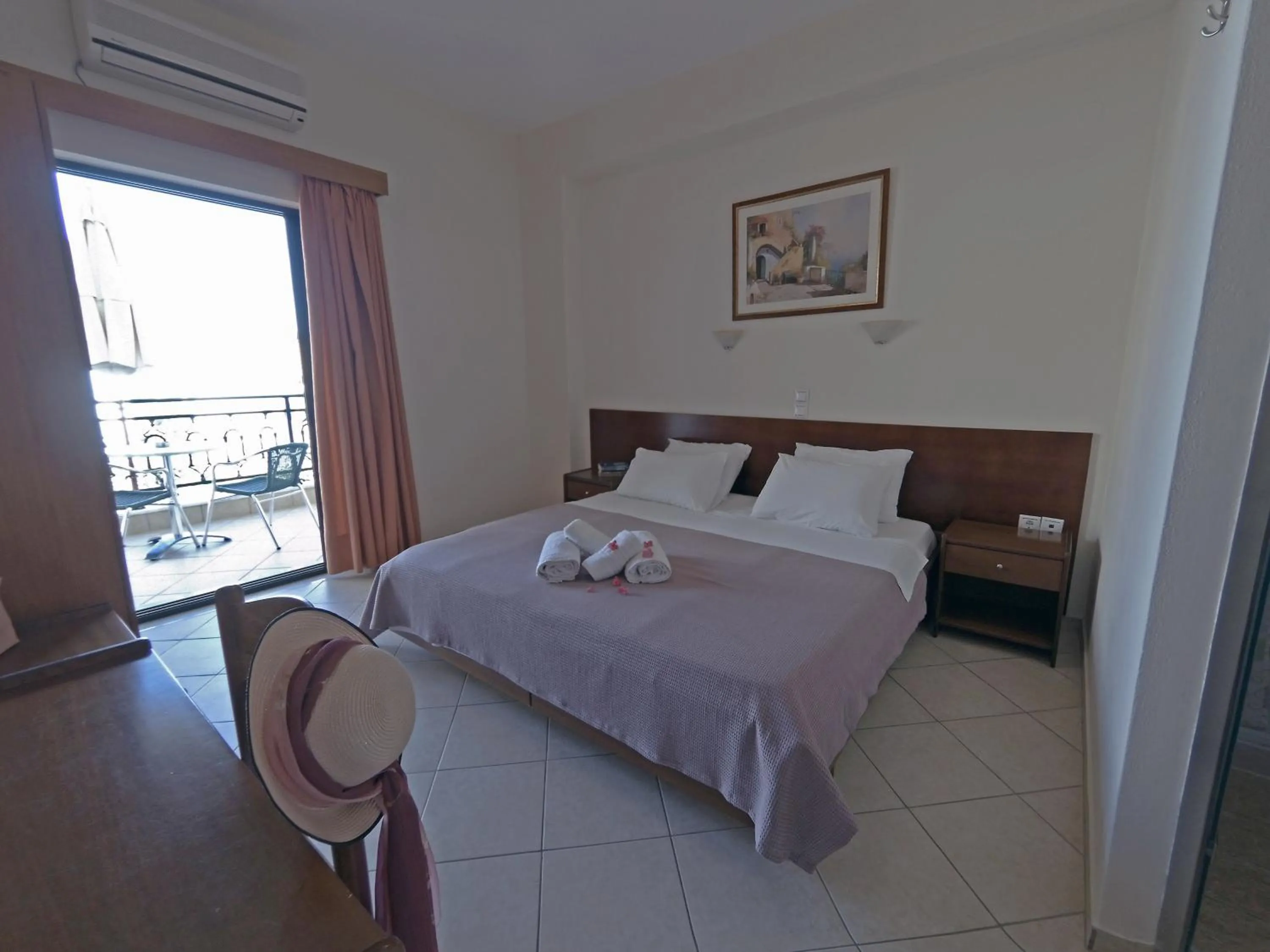 Bed in Hotel Loukas Vrachos