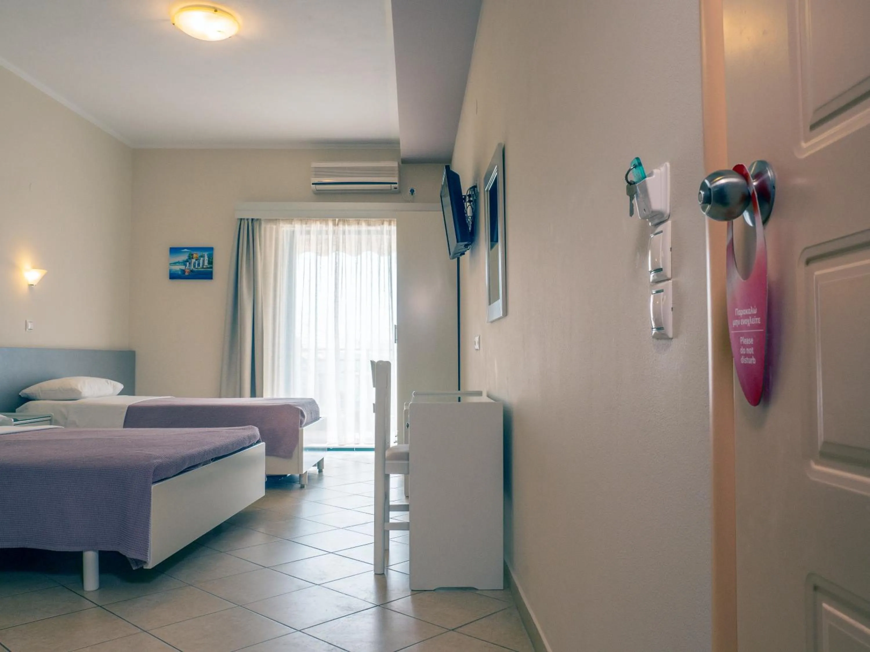 Bed in Hotel Loukas Vrachos