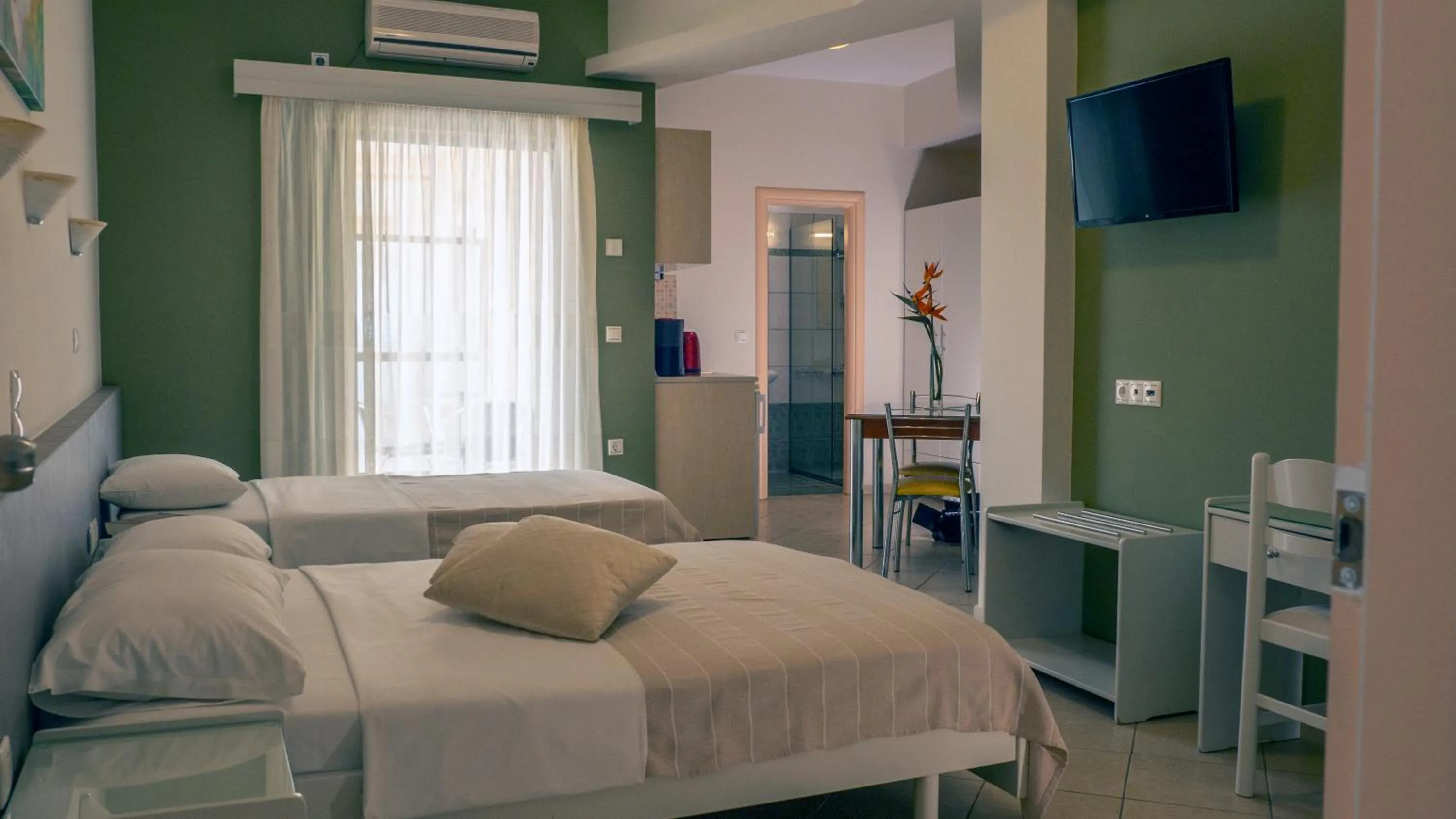 Bed in Hotel Loukas Vrachos
