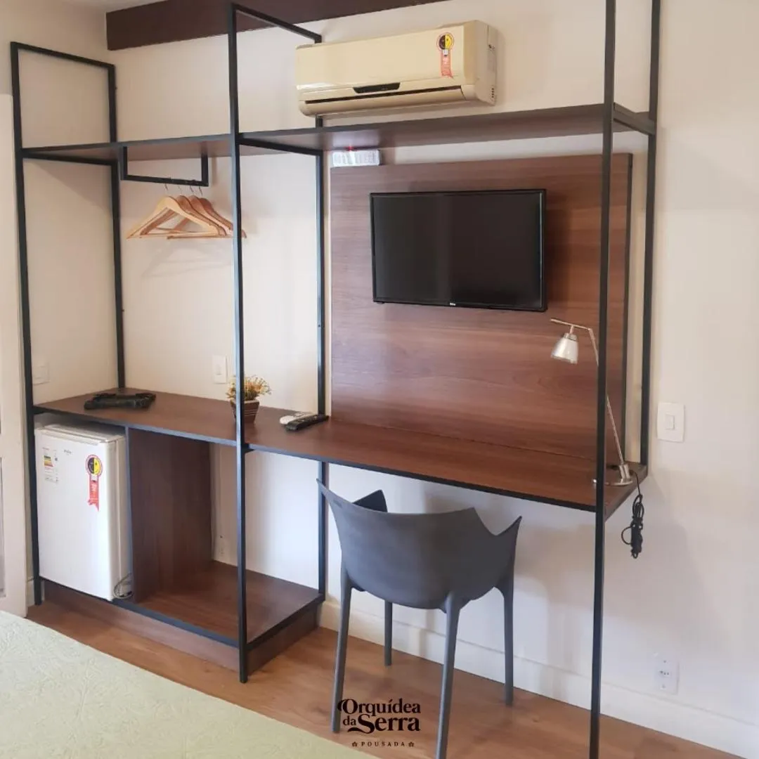 TV and multimedia in Pousada Orquidea da Serra