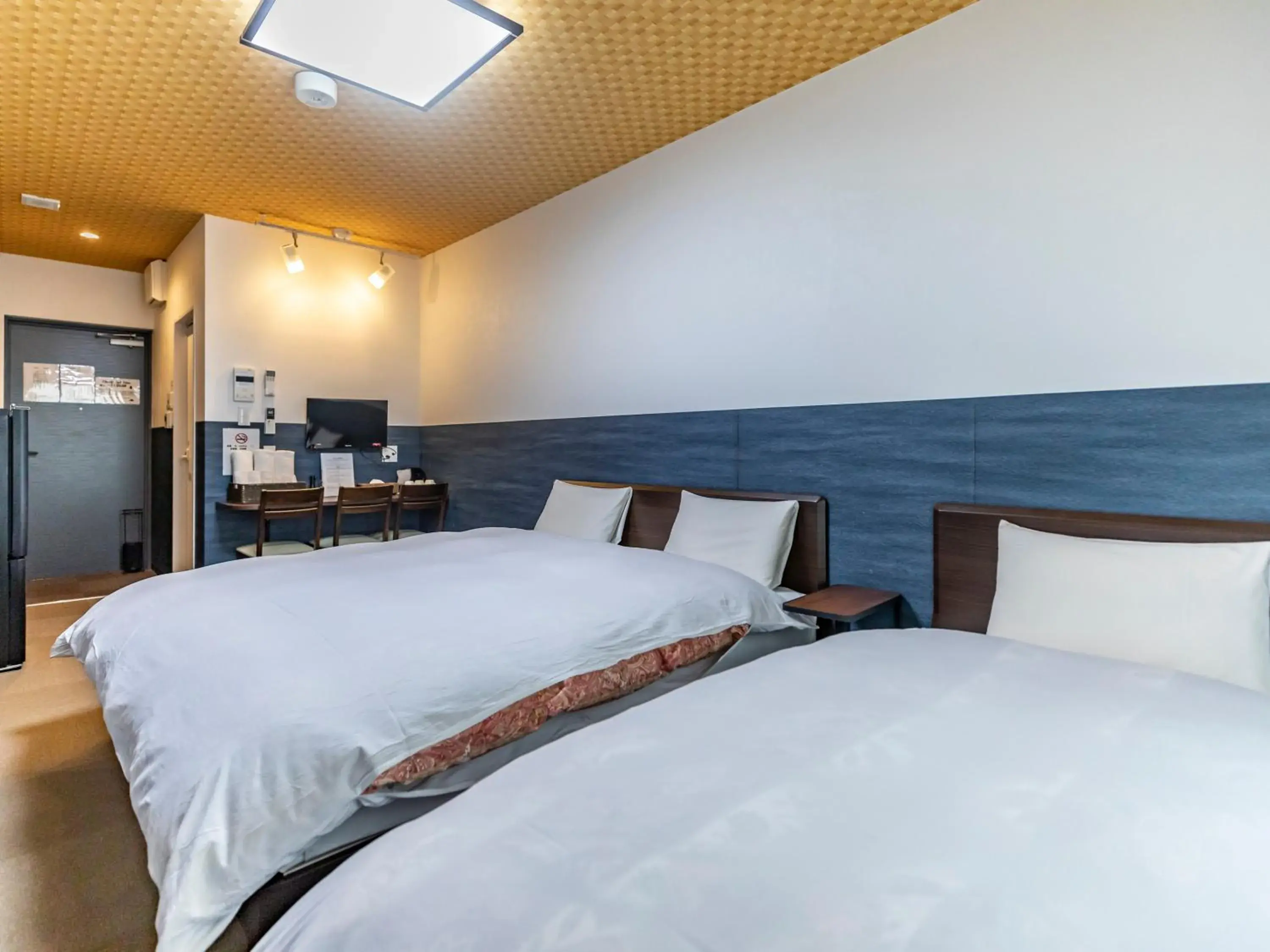 Bed in Tabist Kyogura Kyoto Nijo Bed in Tabist Kyogura Kyoto Nijo