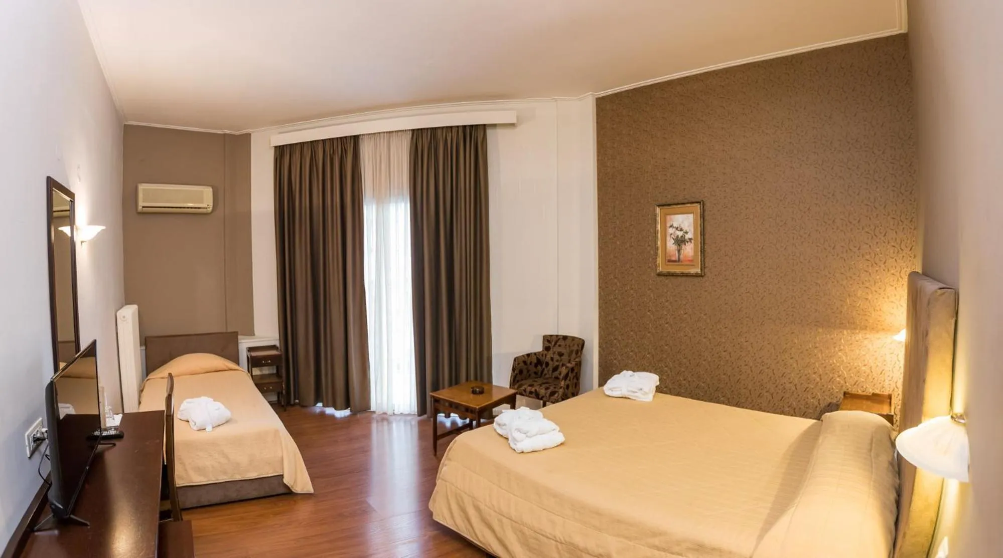 Bed in Achillion Hotel