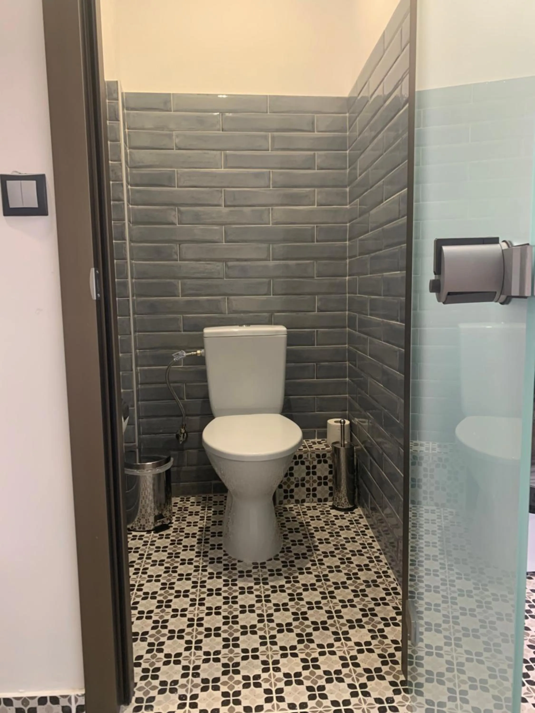 Toilet in White Bottle Superior Apartments