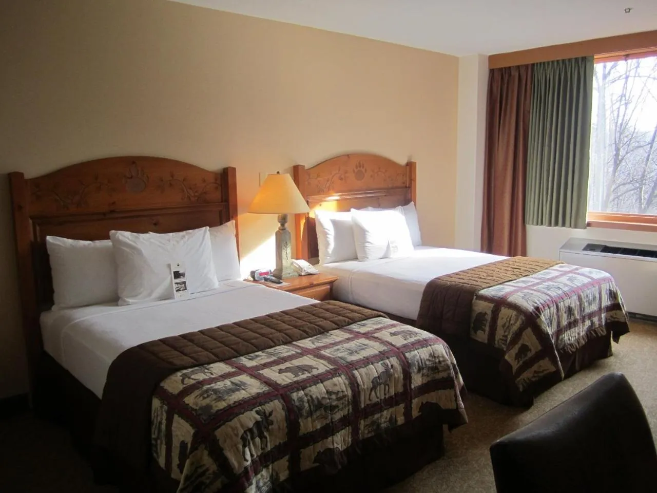 Shower, Bed in Overlook Lodge and Stone Cottages at Bear Mountain