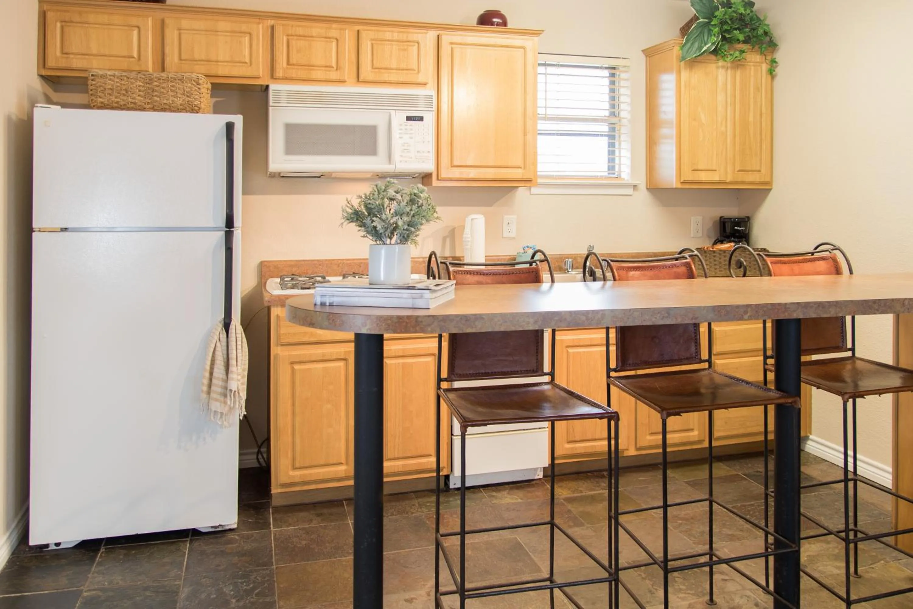 Kitchen or kitchenette in Vineyard Court Designer Suites Hotel