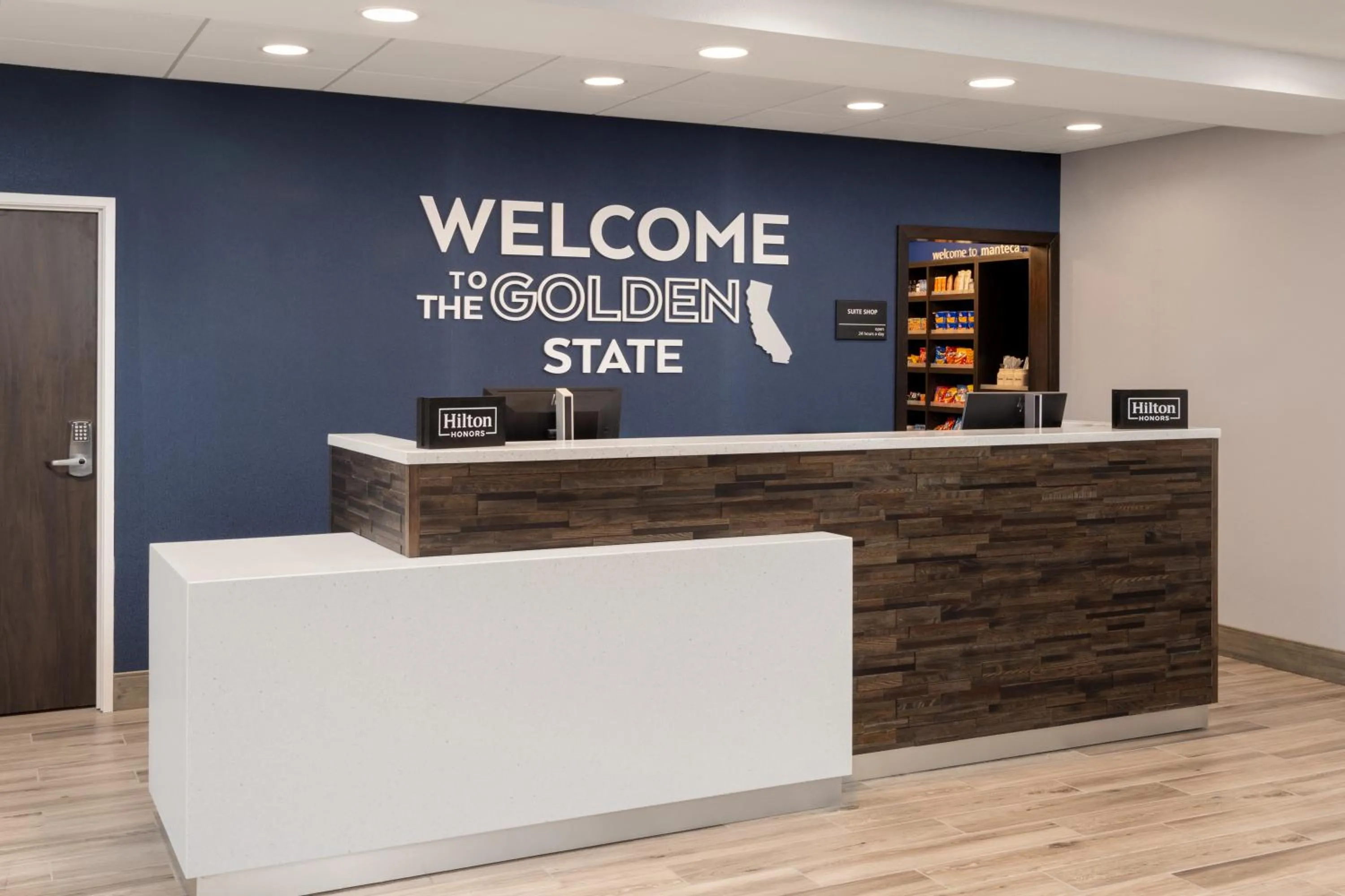 Property logo or sign in Hampton Inn & Suites Manteca