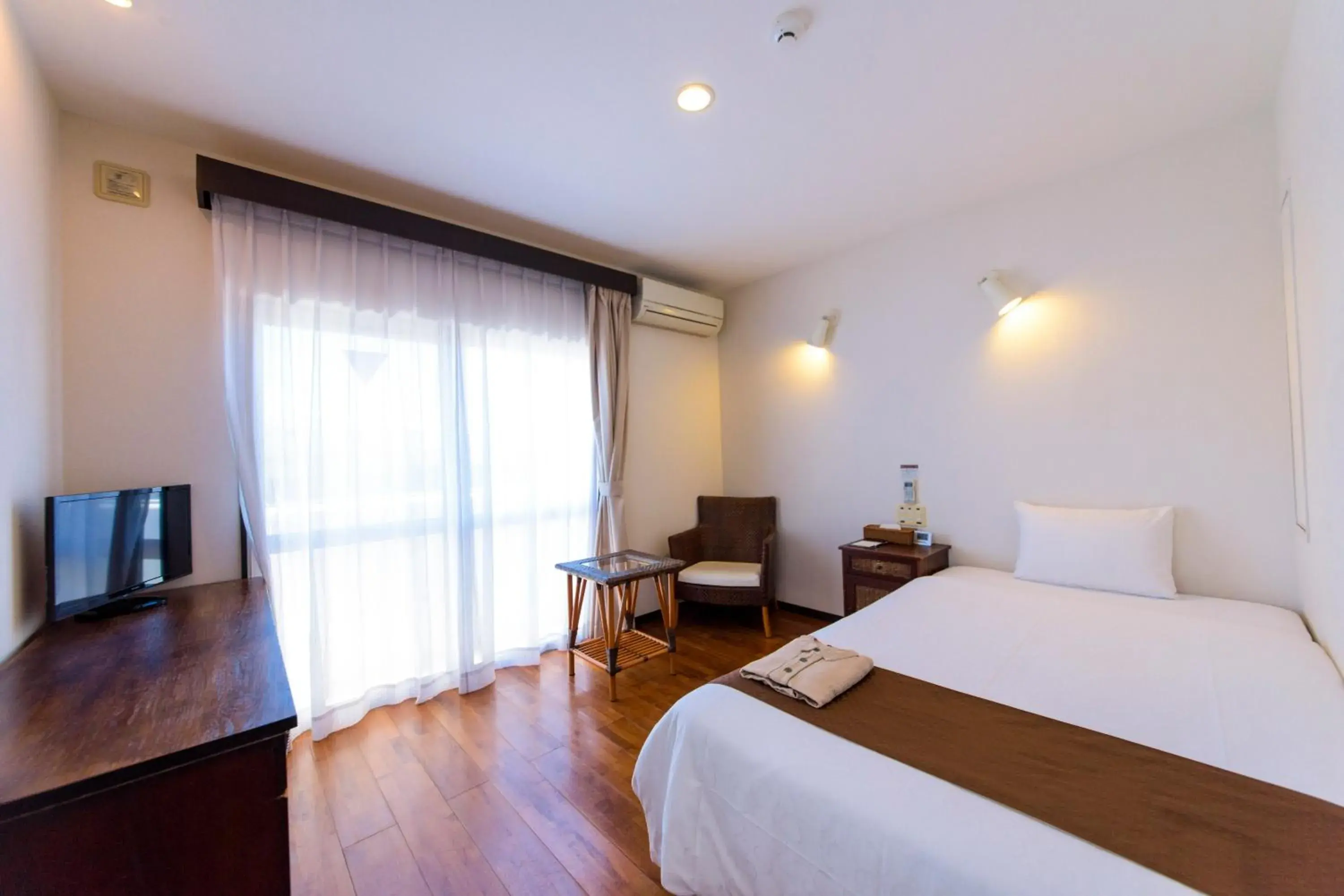 Photo of the whole room, Bed in Hotel Patina Ishigakijima Photo of the whole room, Bed in Hotel Patina Ishigakijima