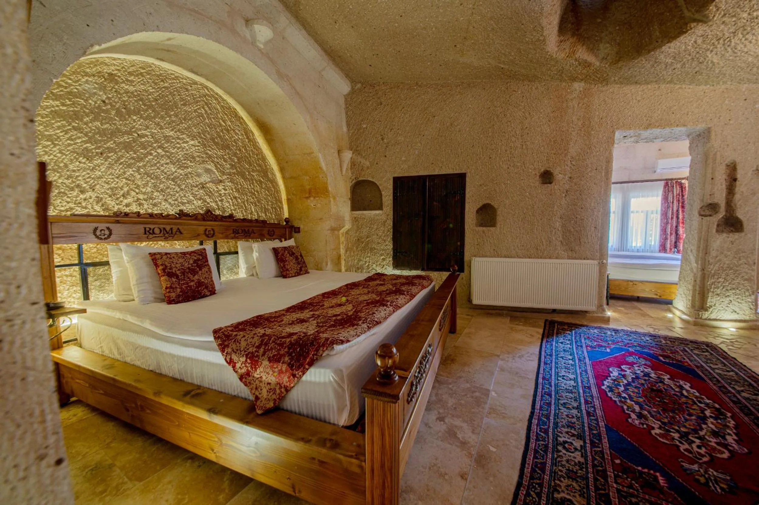 Bed in Roma Cave Suite