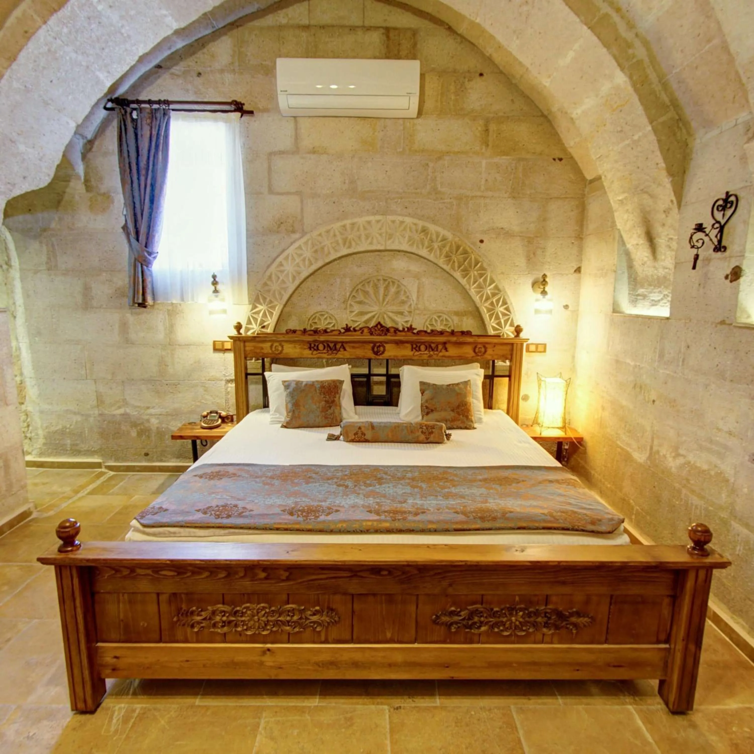 Bed in Roma Cave Suite