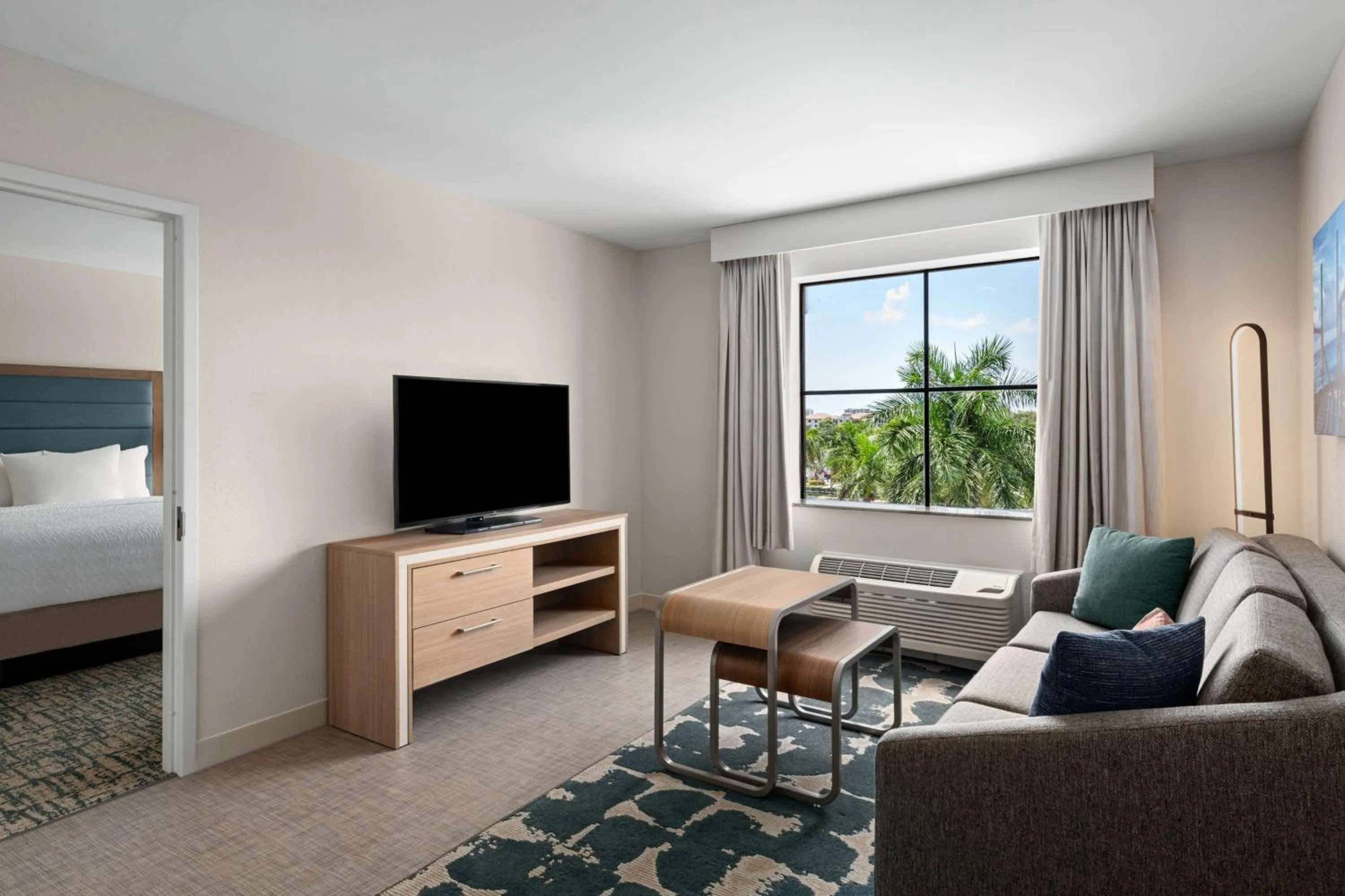 Living room, Bed in Homewood Suites by Hilton West Palm Beach