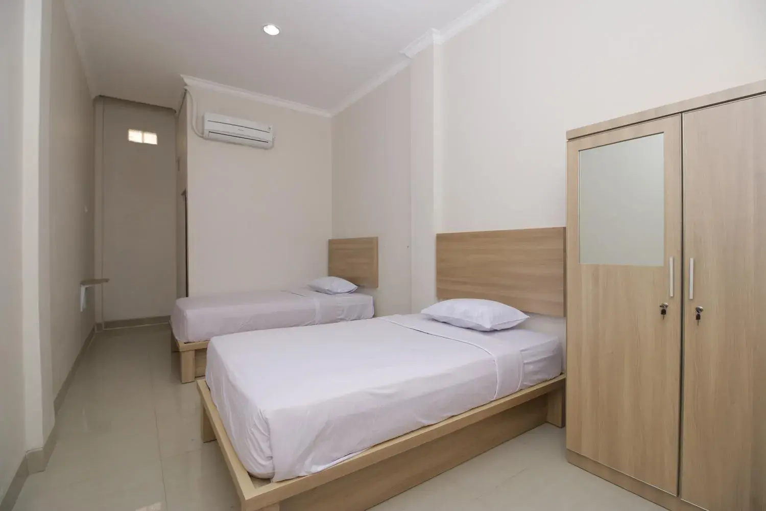 Bed in RedDoorz near Jalan Kolonel Haji Burlian Palembang Bed in RedDoorz near Jalan Kolonel Haji Burlian Palembang
