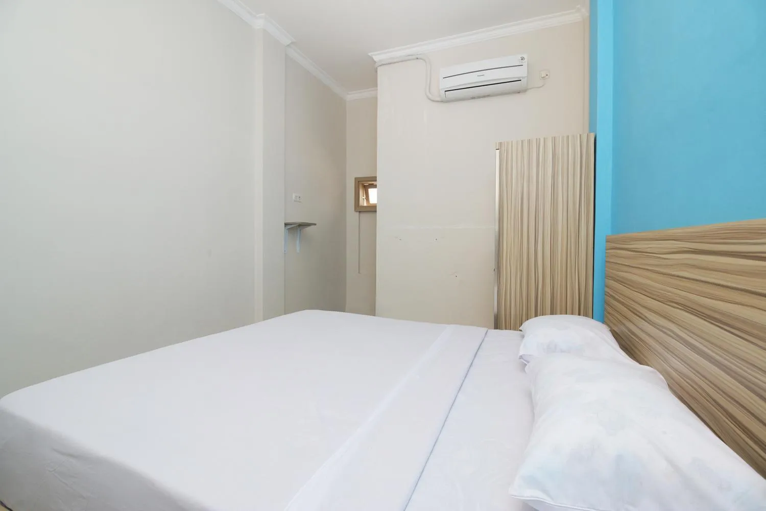 Bed in RedDoorz near Jalan Kolonel Haji Burlian Palembang