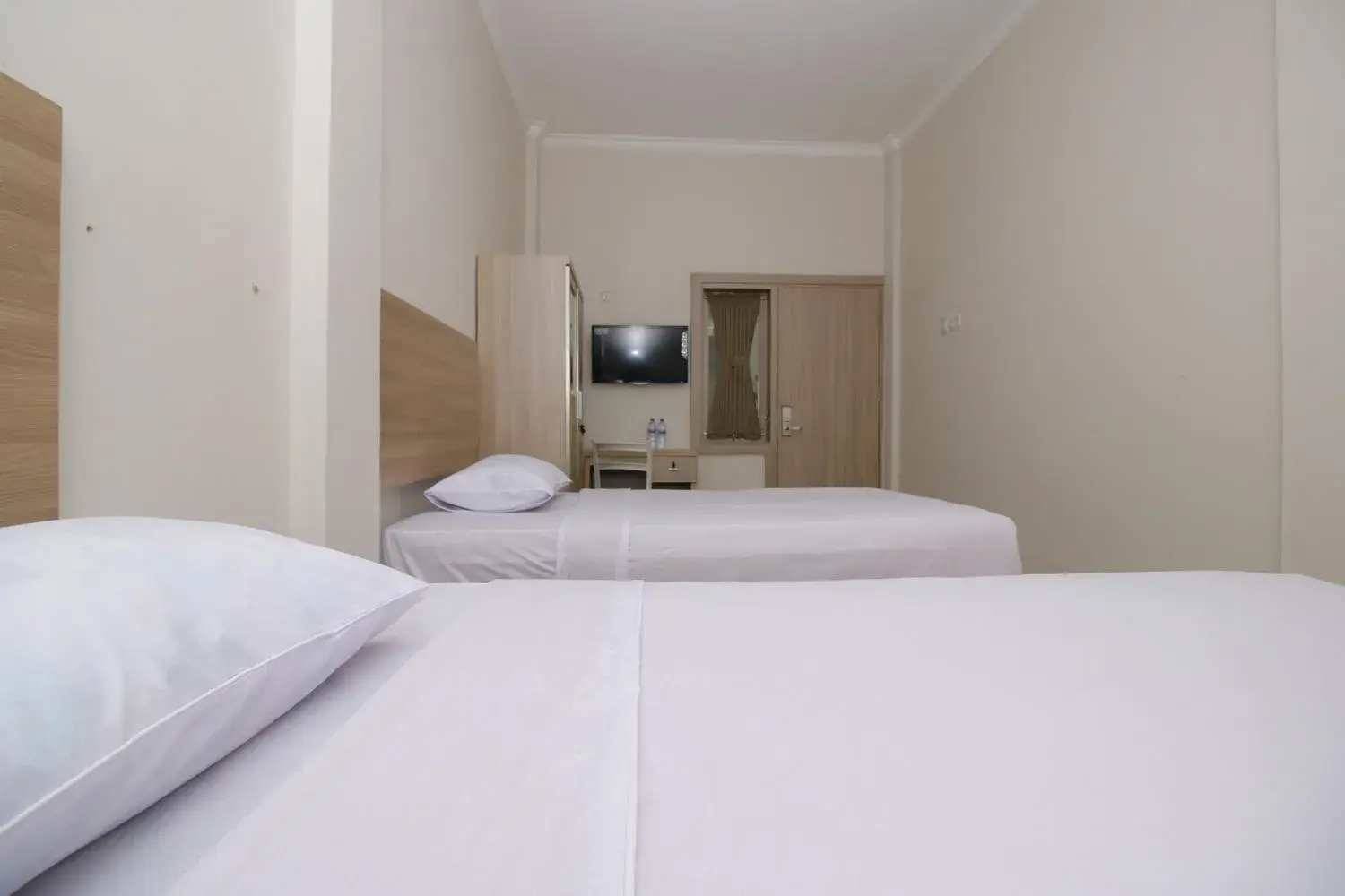 Bed in RedDoorz near Jalan Kolonel Haji Burlian Palembang Bed in RedDoorz near Jalan Kolonel Haji Burlian Palembang