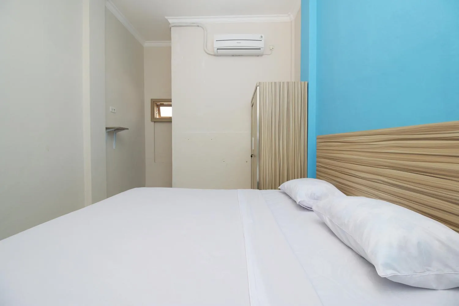 Bed in RedDoorz near Jalan Kolonel Haji Burlian Palembang