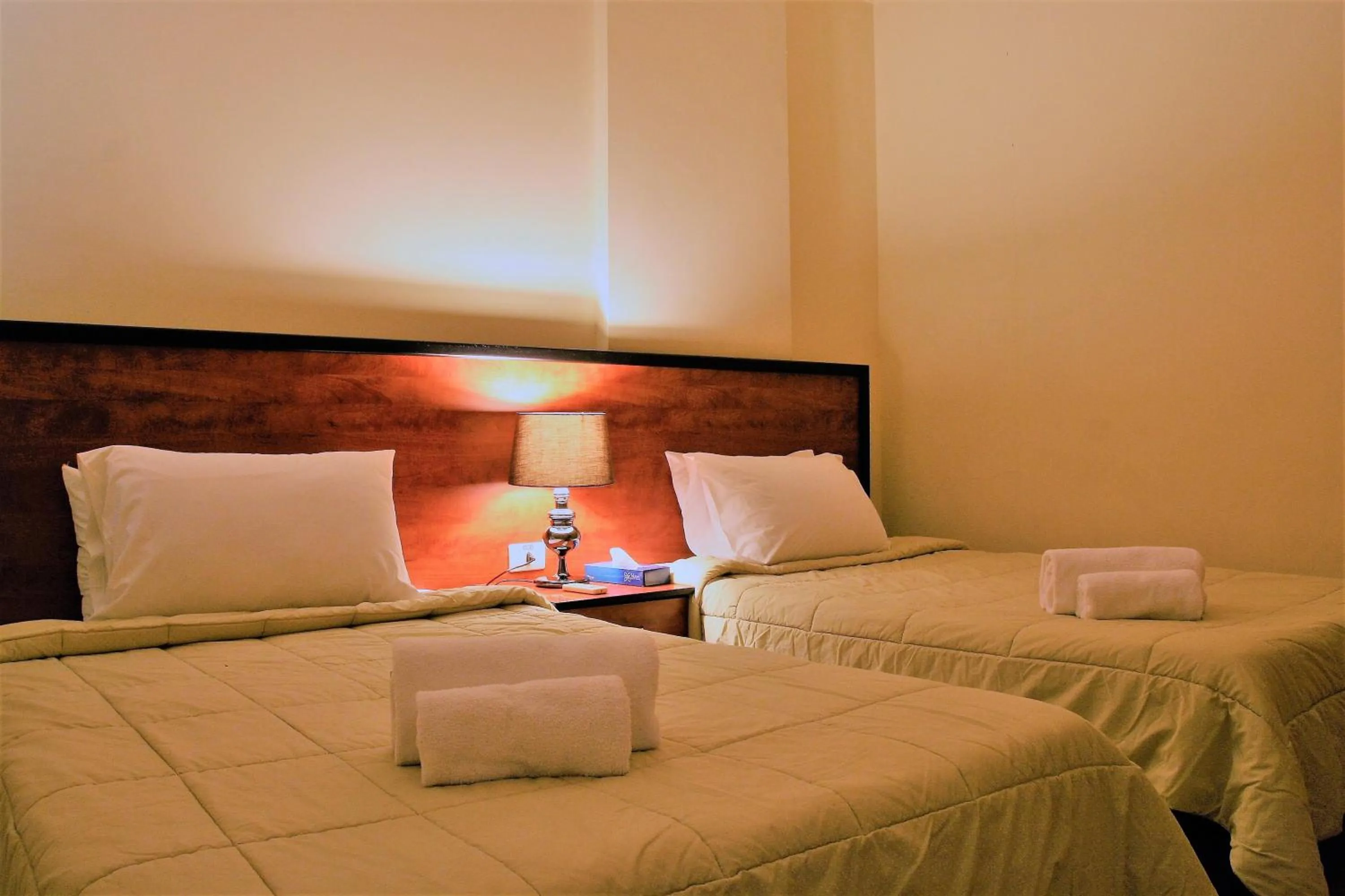 Bed in Byblos Comfort Hotel