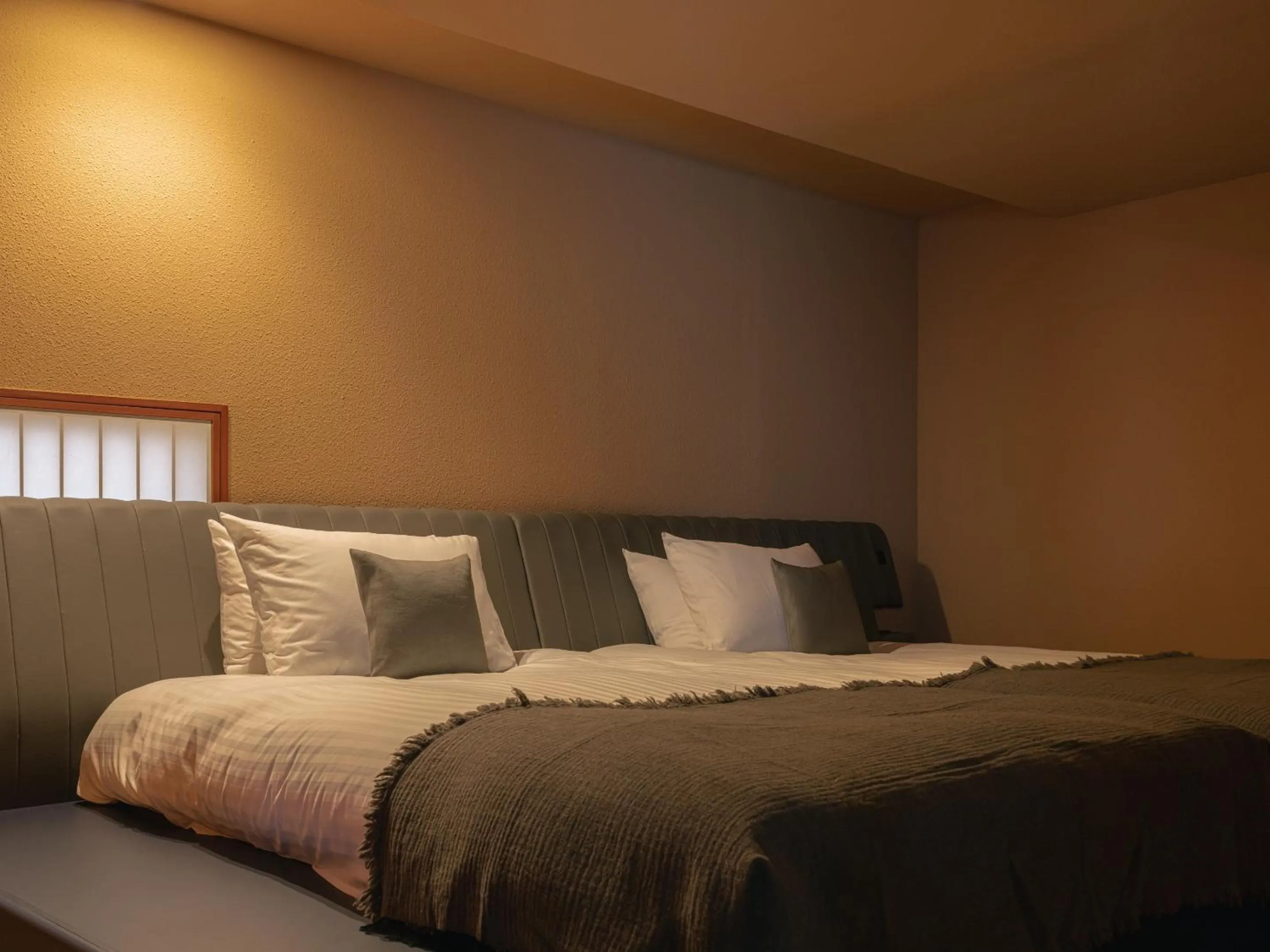 Bed in OTARU RETREAT by Onko Chishin