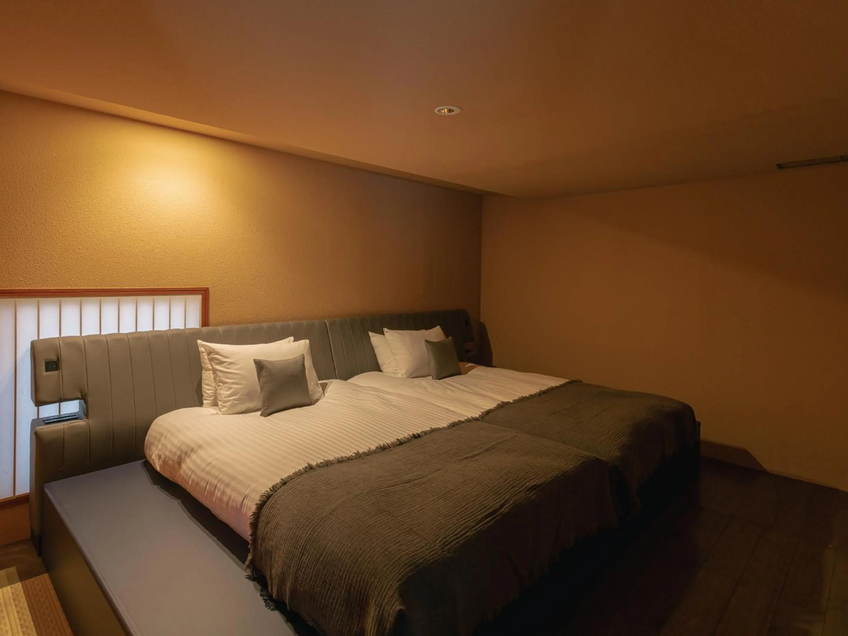 Bed in OTARU RETREAT by Onko Chishin