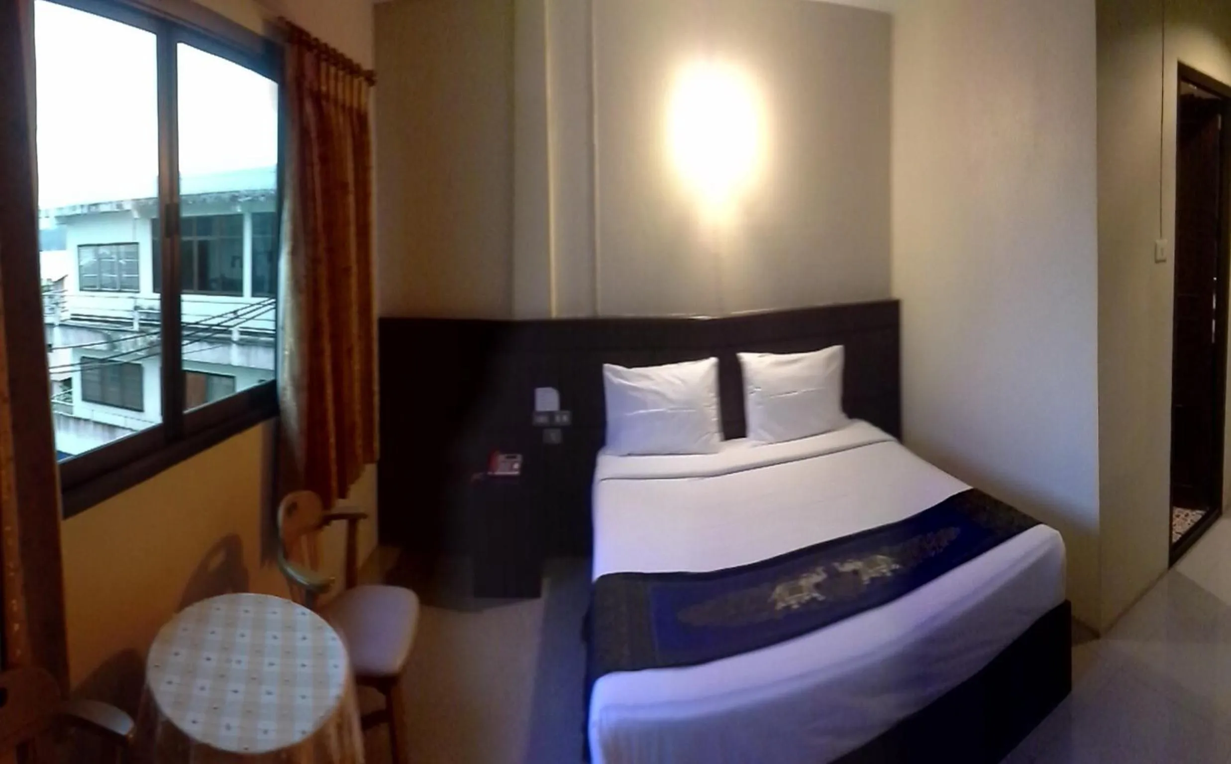 Bedroom in Chiangkhong Green Inn Resident