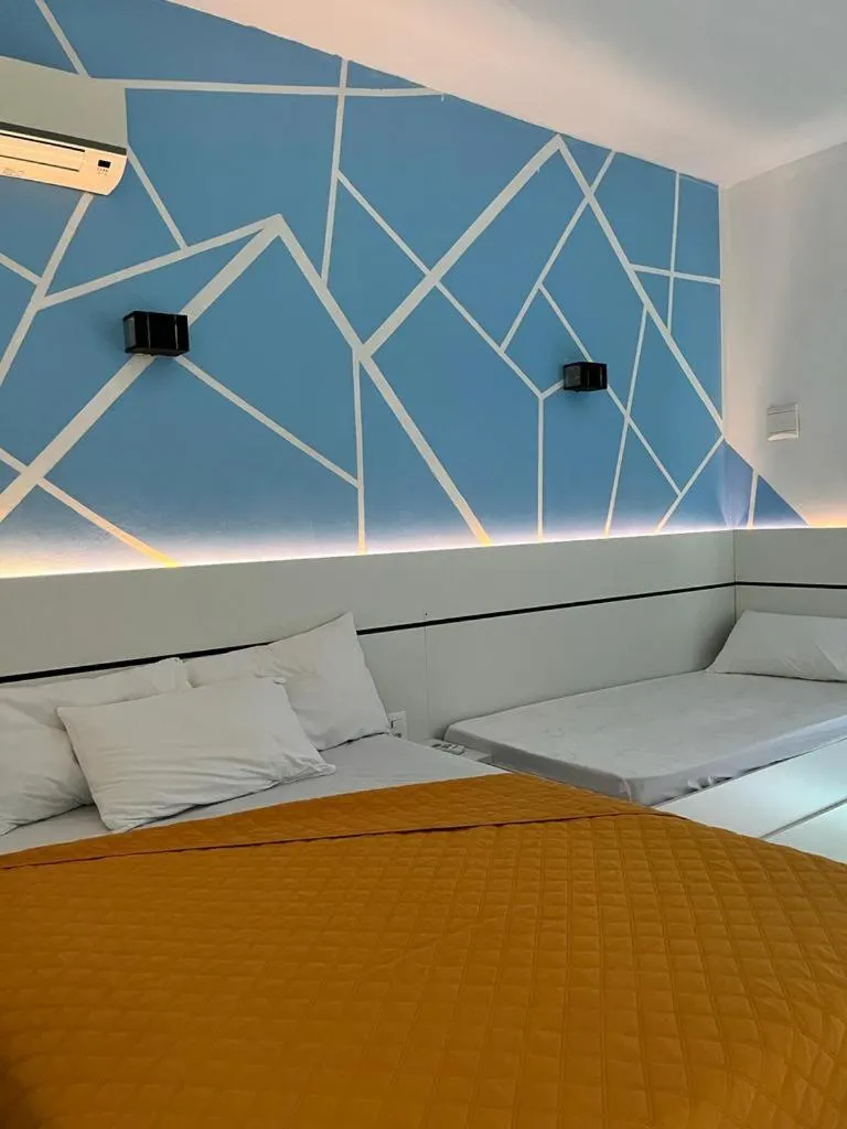 Bed in Marlindo Hospedagem