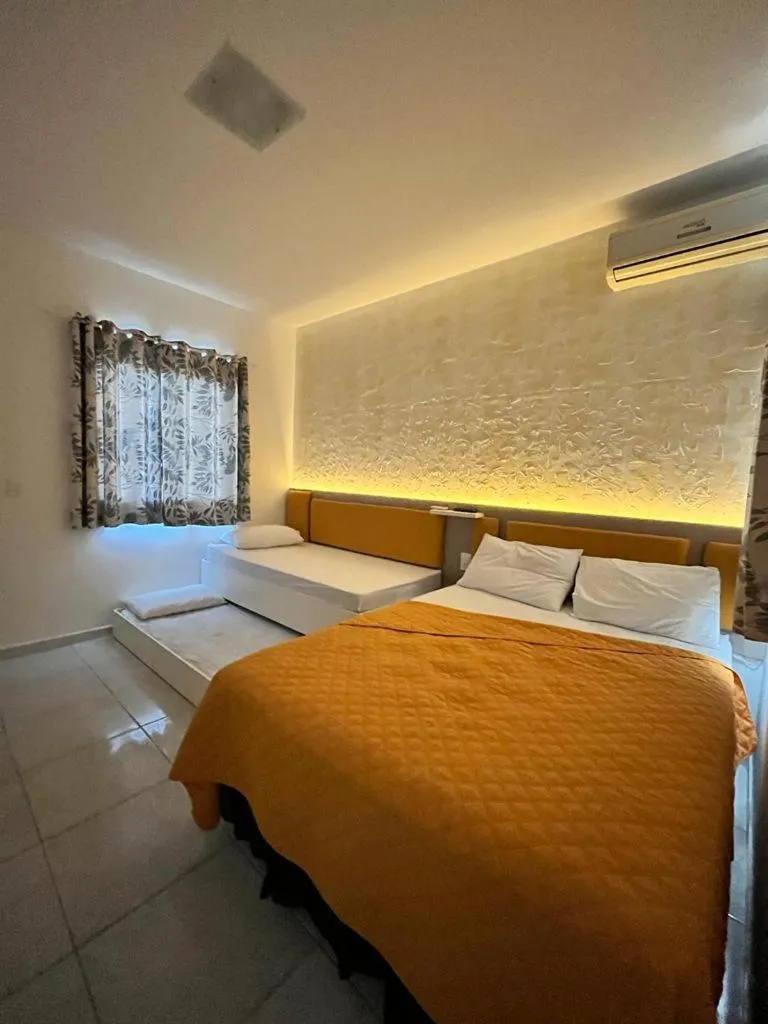 Bed in Marlindo Hospedagem