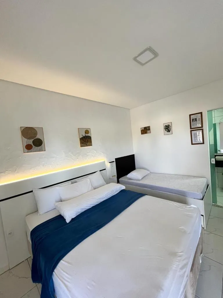 Bed in Marlindo Hospedagem