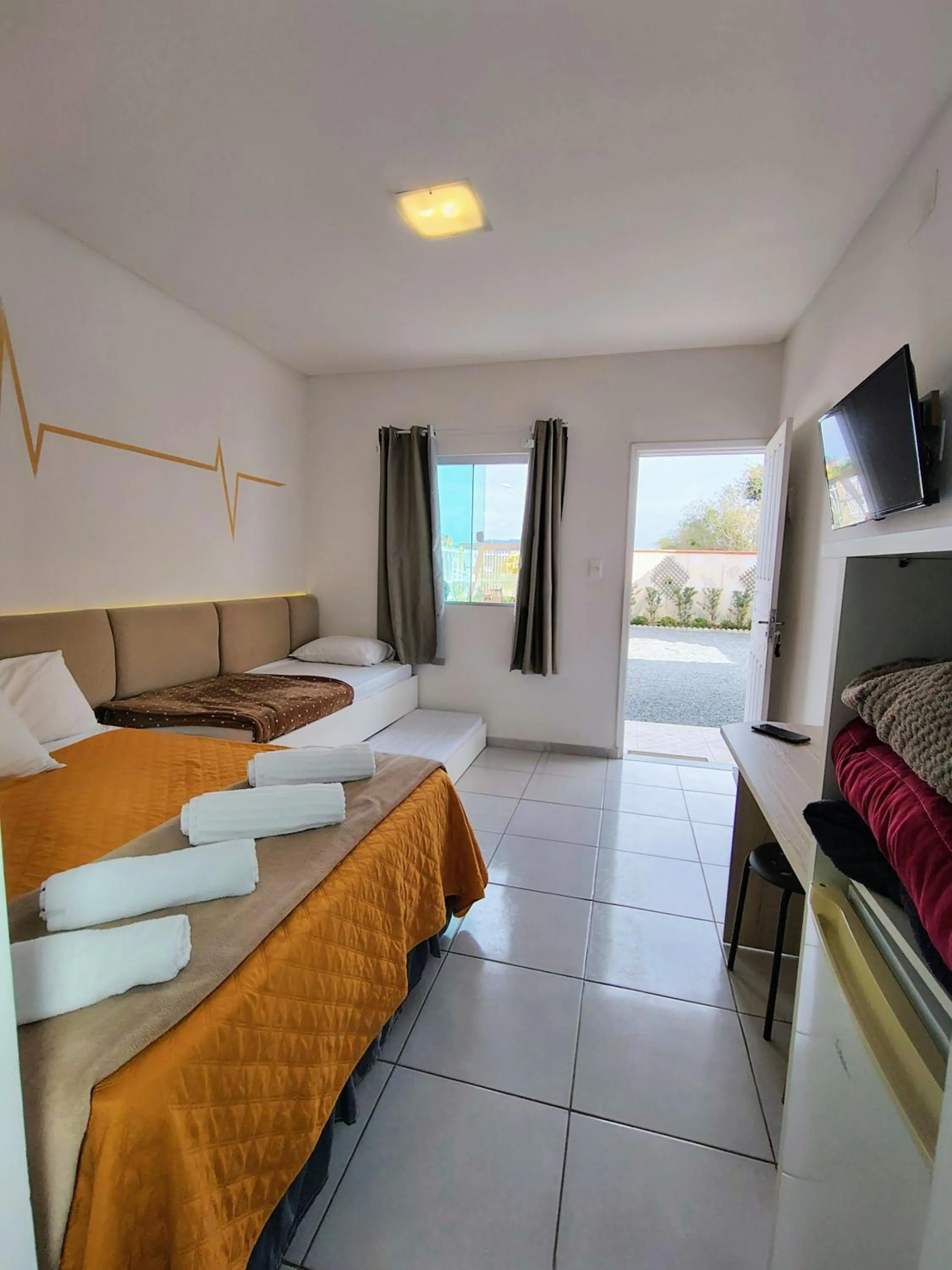 Bed in Marlindo Hospedagem