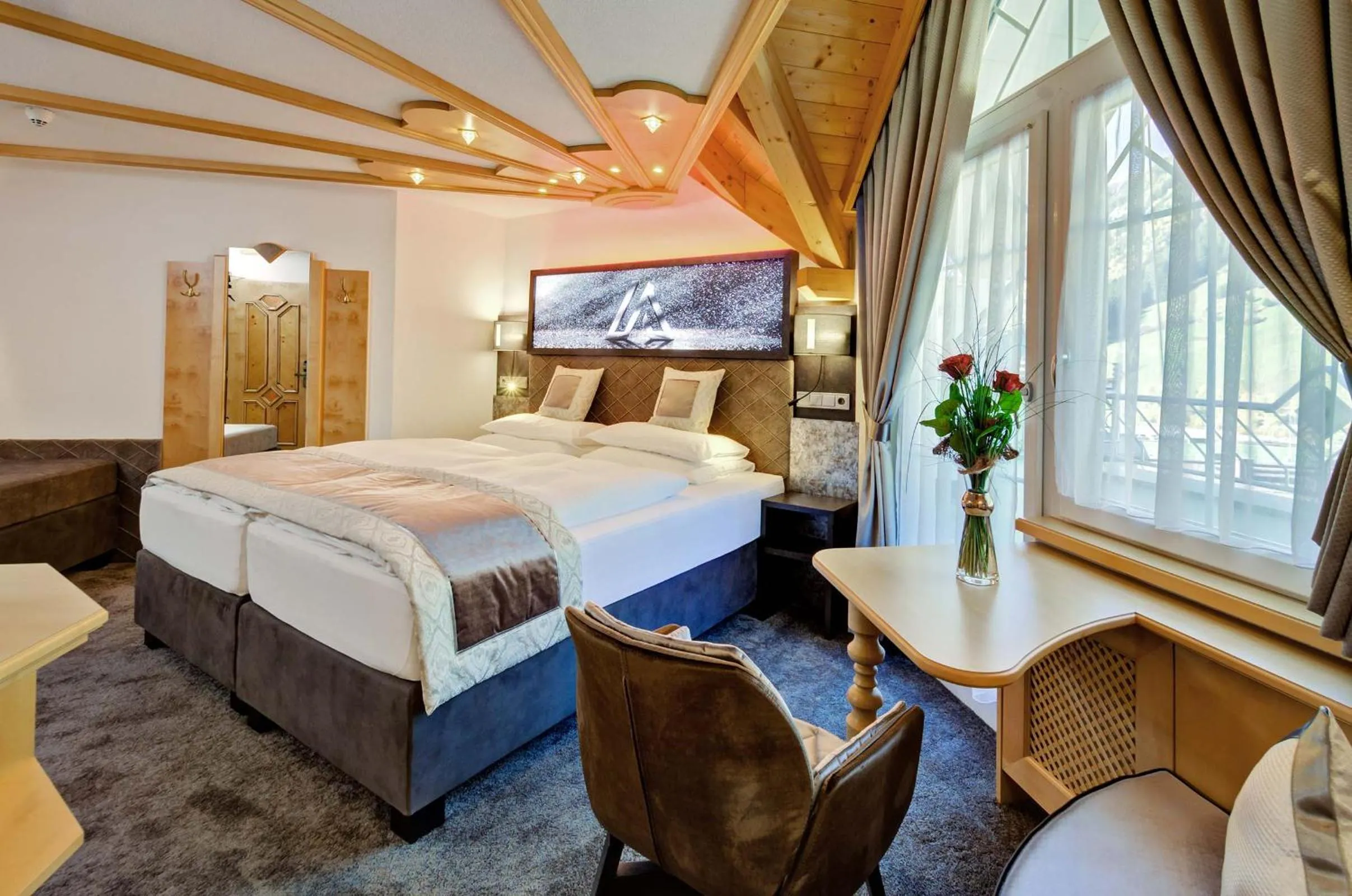 Photo of the whole room, Bed in Alpinstyle Hotel Ischgl