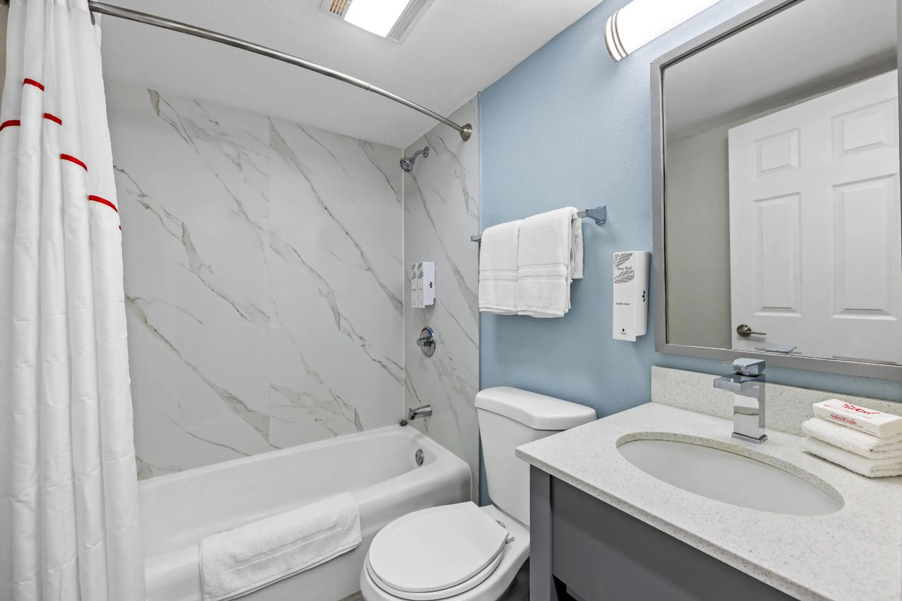 Bathroom in HomeTowne Studios by Red Roof Athens, TN