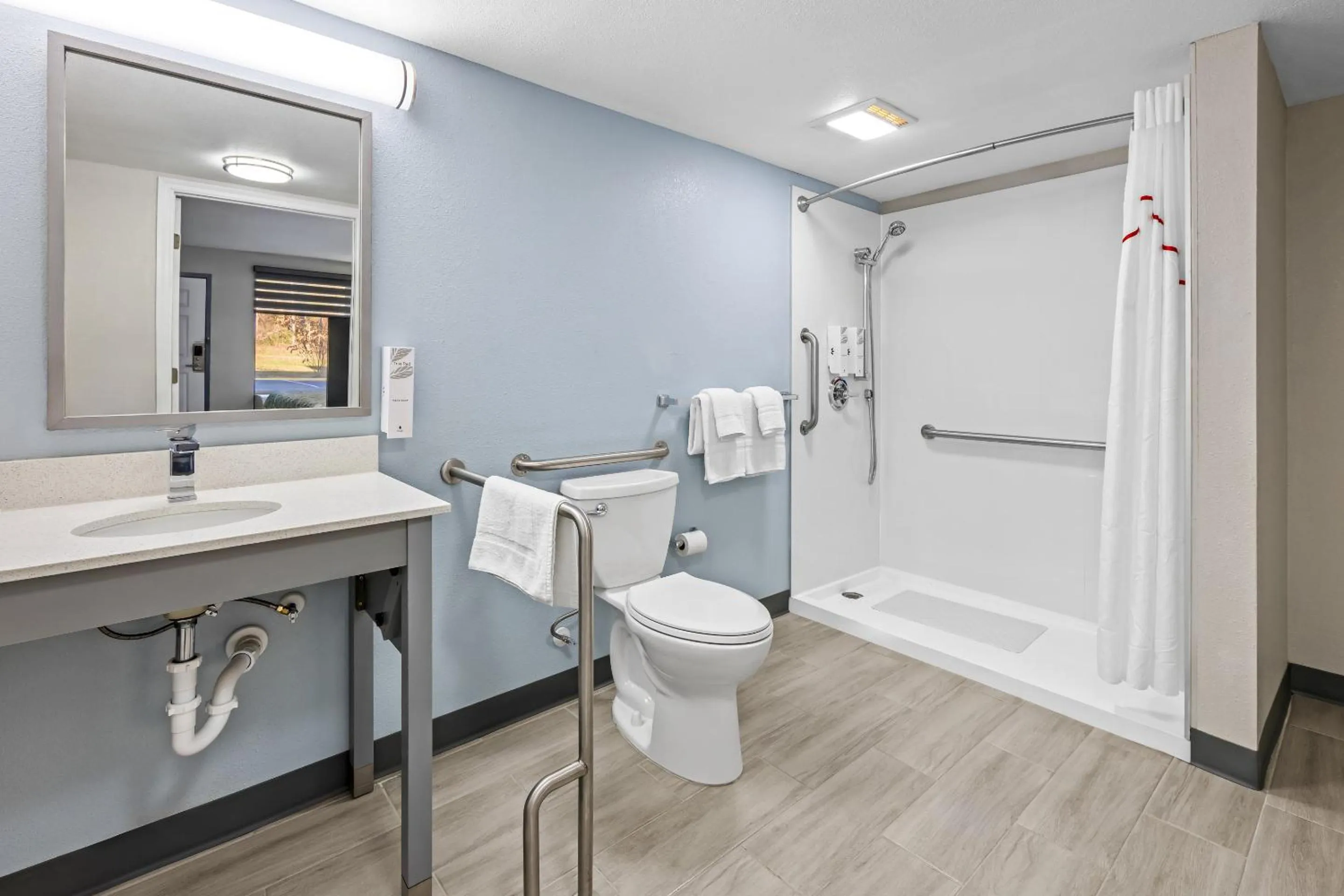 Bathroom in HomeTowne Studios by Red Roof Athens, TN