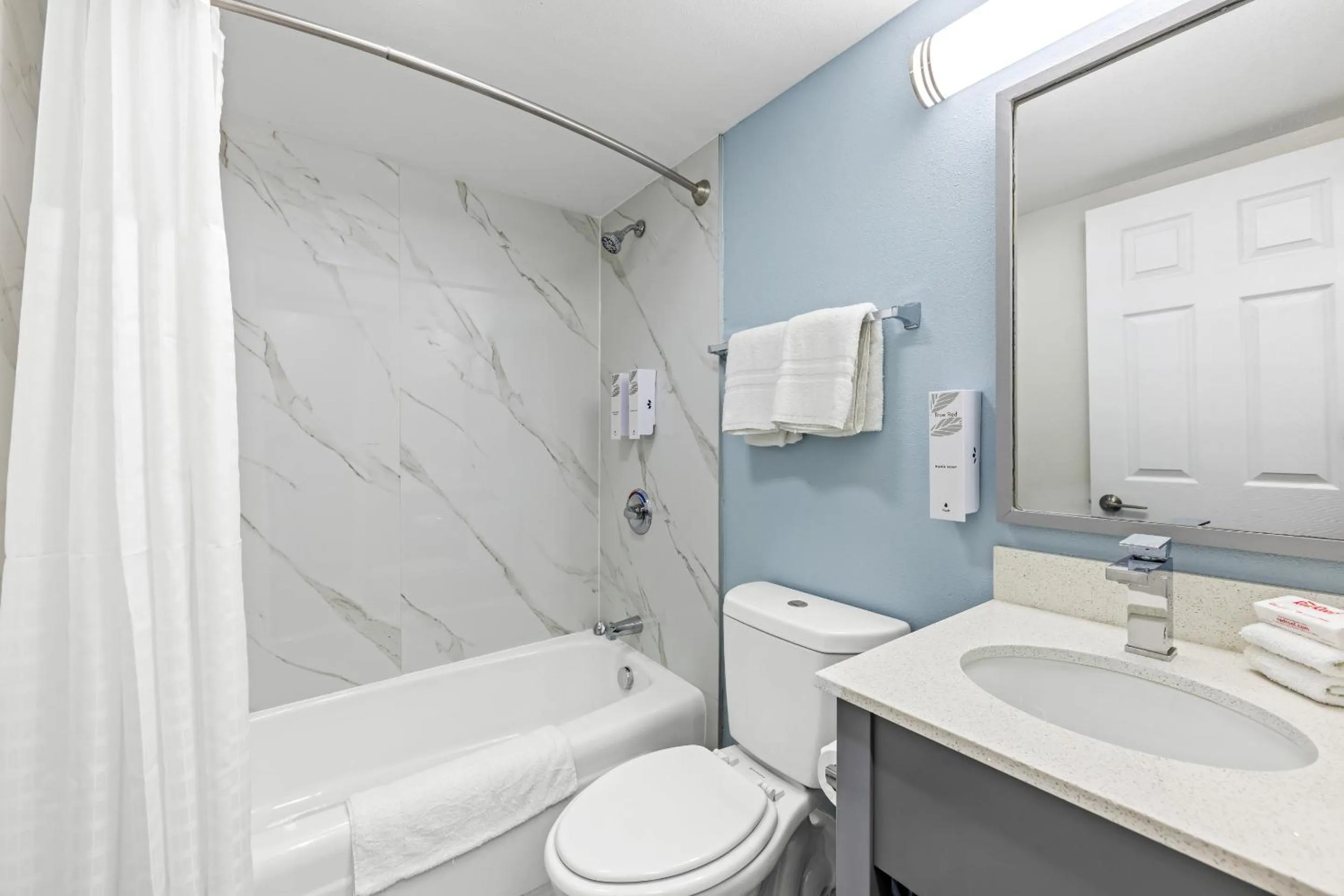 Bathroom in HomeTowne Studios by Red Roof Athens, TN