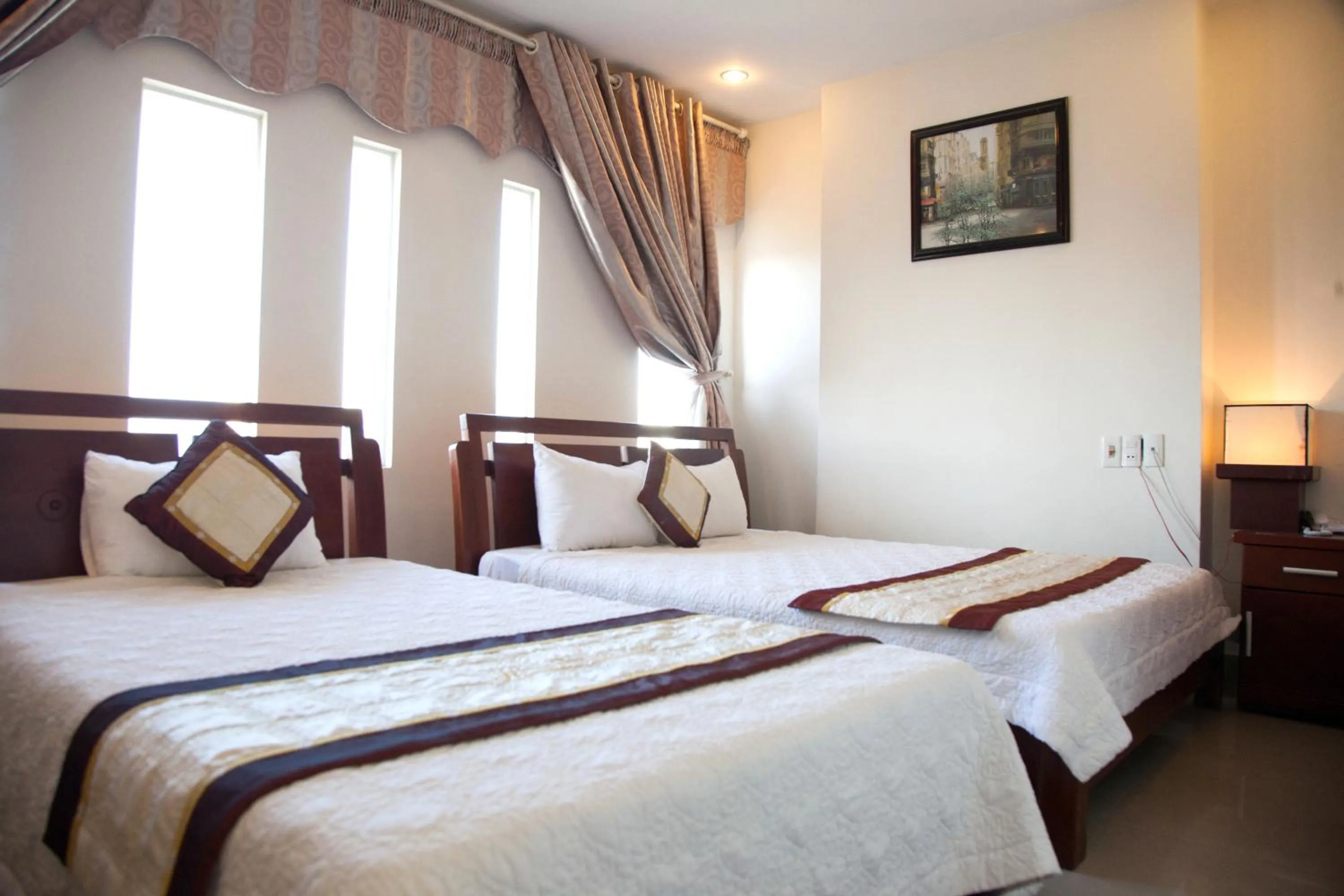 Bed in Hoang Thuy Sinh Hotel