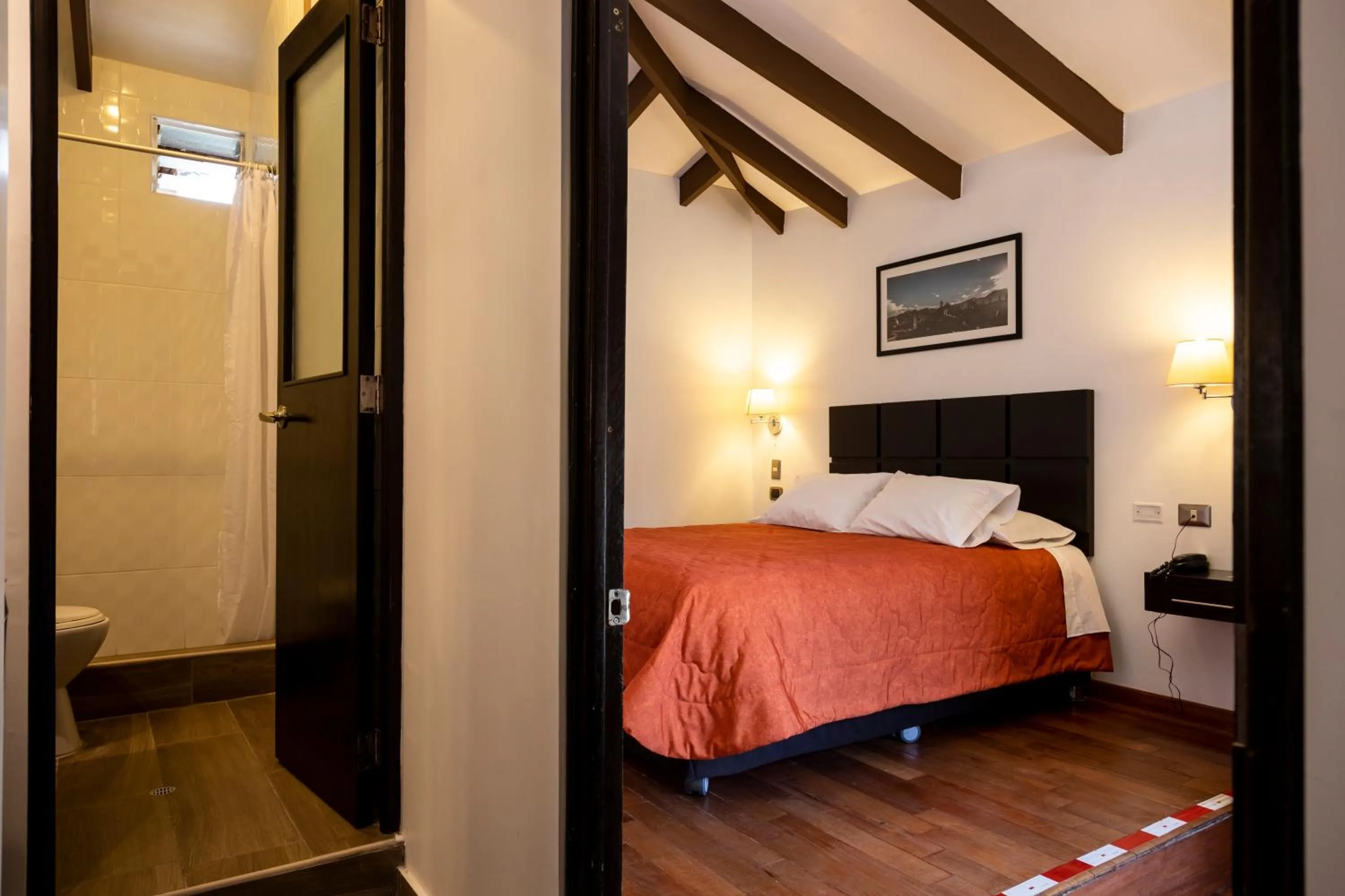 Photo of the whole room, Bed in Hostal & Apartments El Triunfo