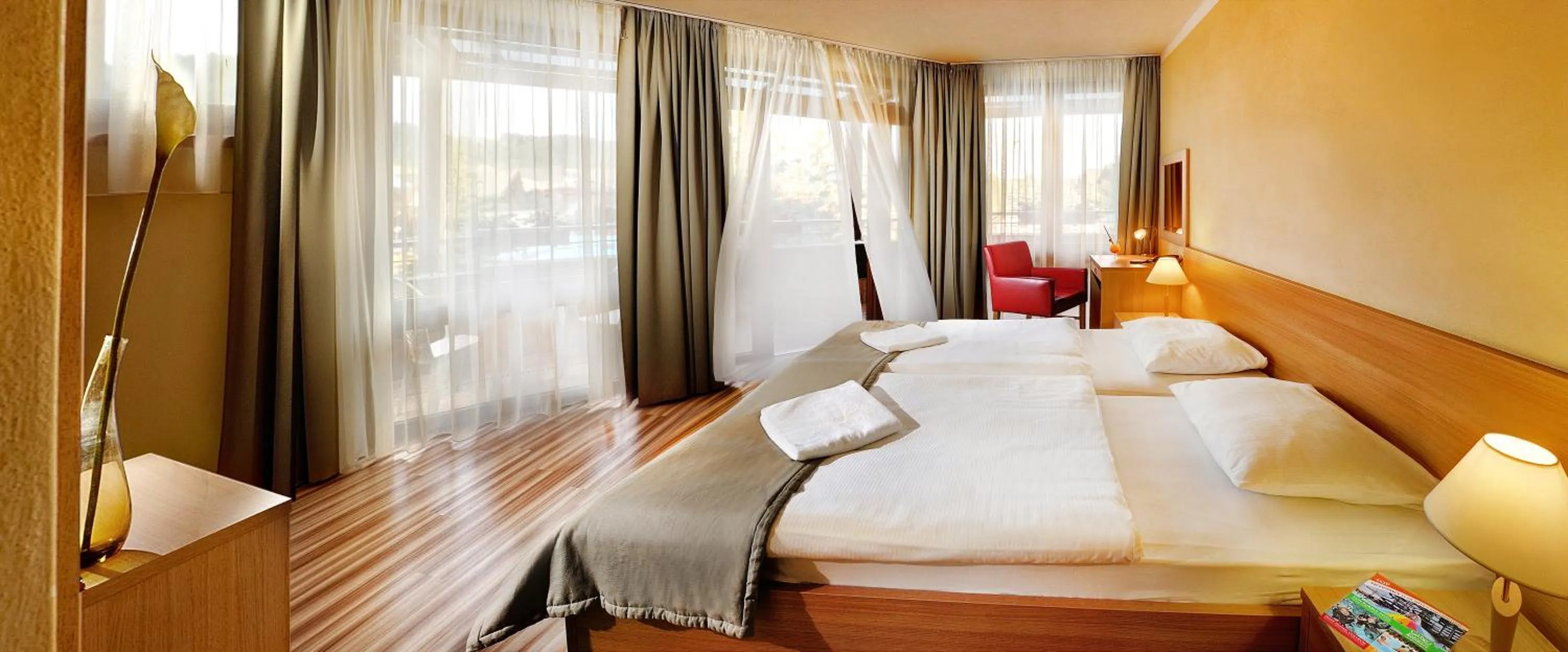 Bathroom, Bed in Hotel Bešeňová