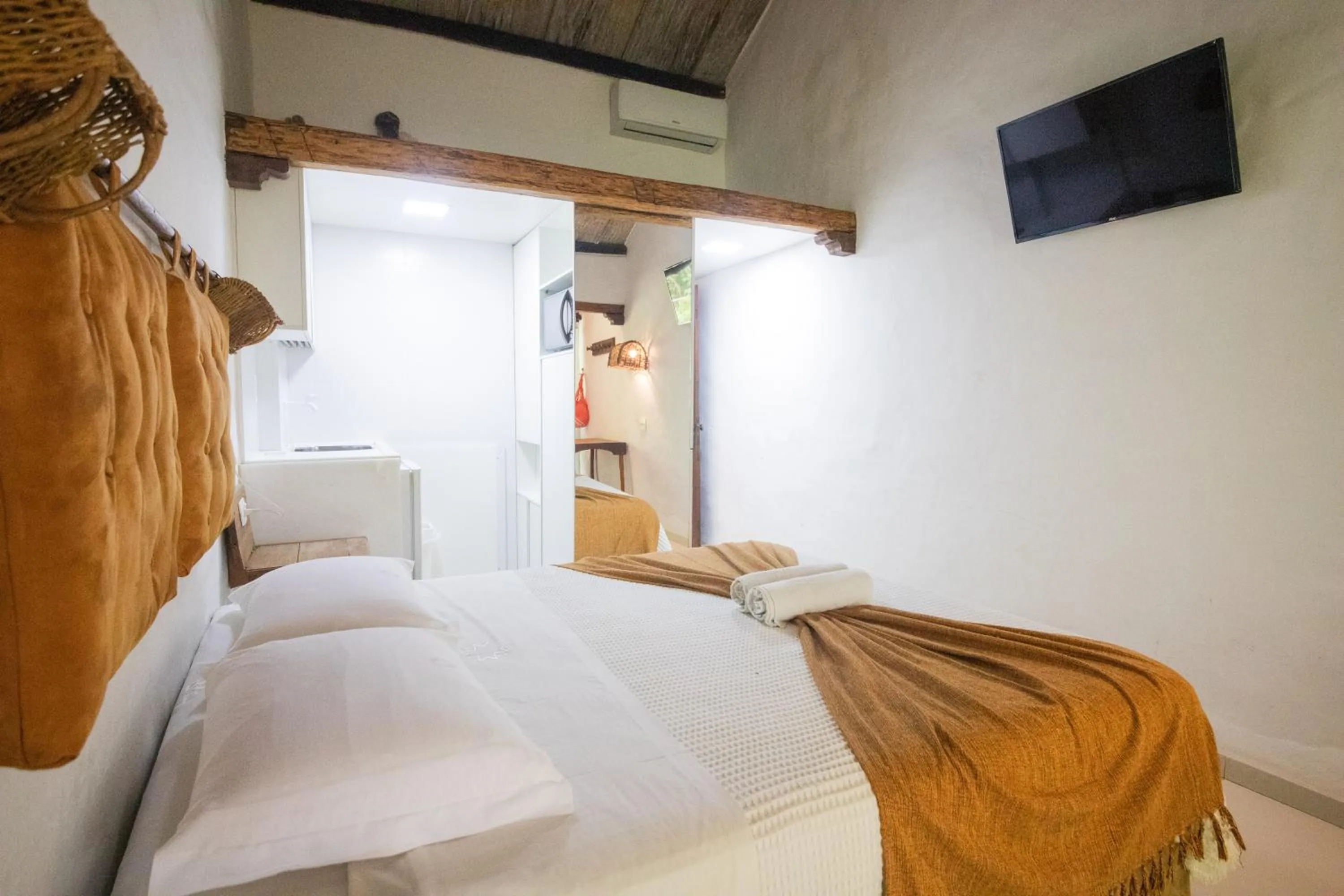 Bed in Pousada Dos Artistas