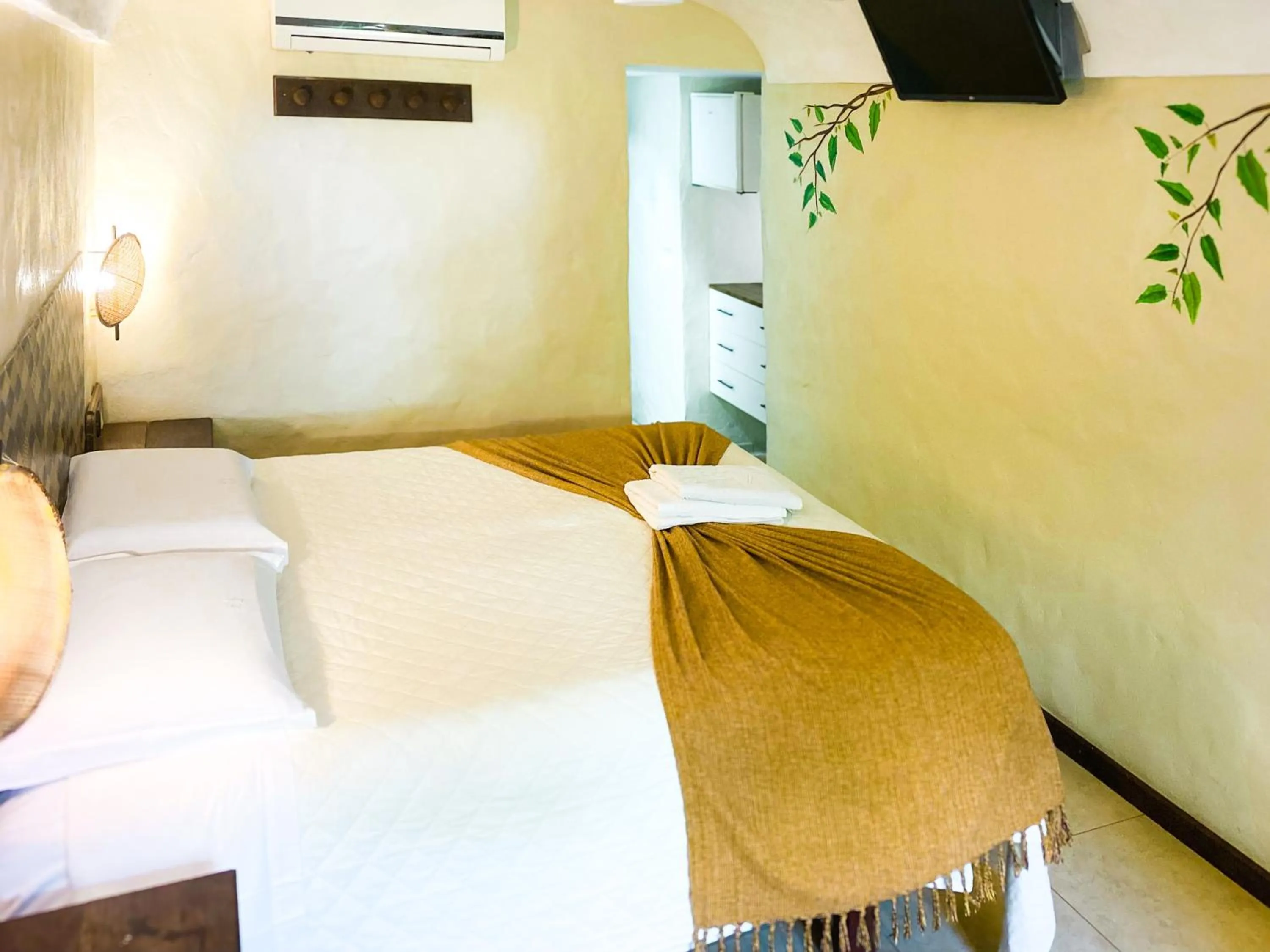 Bed in Pousada Dos Artistas