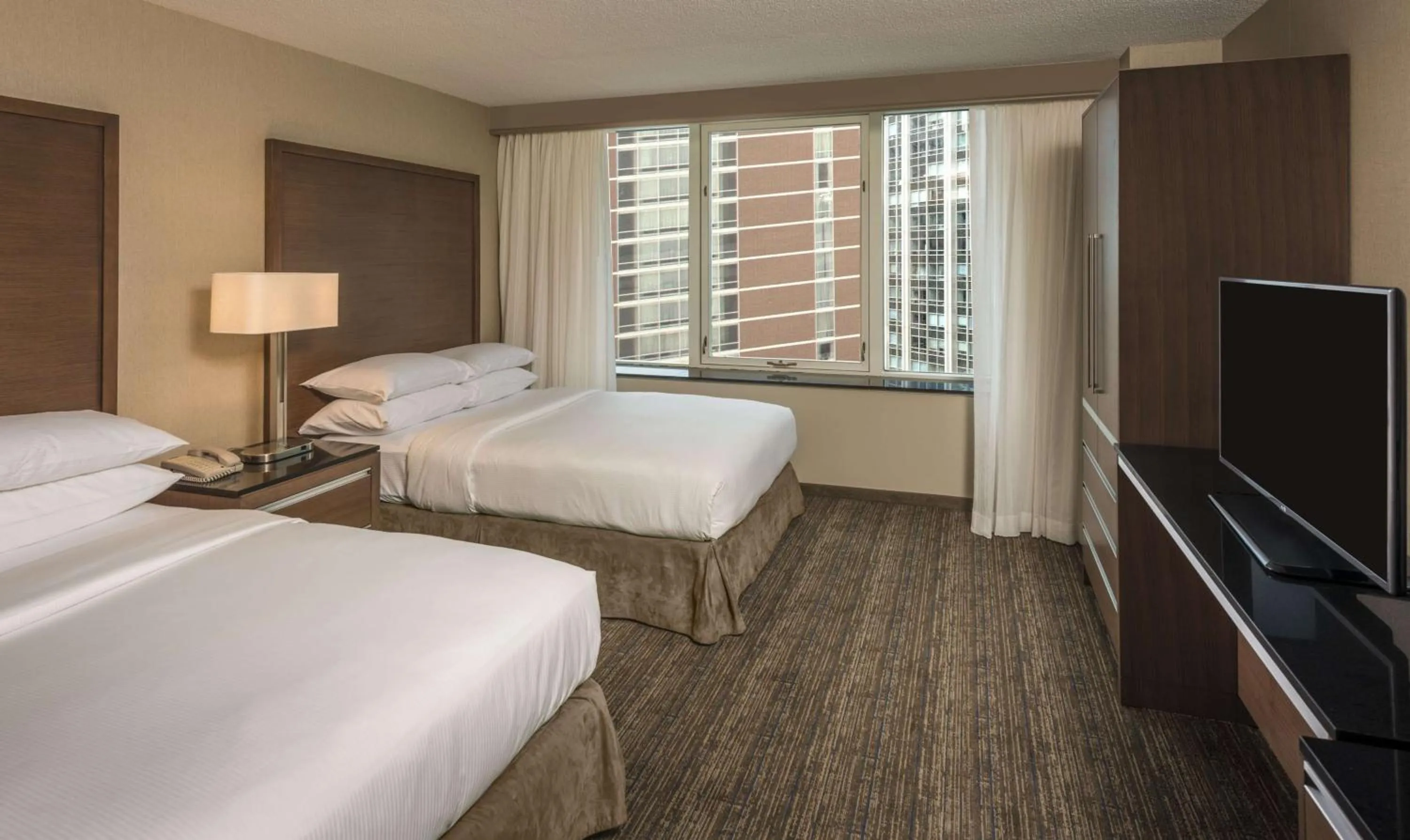 Bed in Embassy Suites by Hilton Chicago Downtown Magnificent Mile